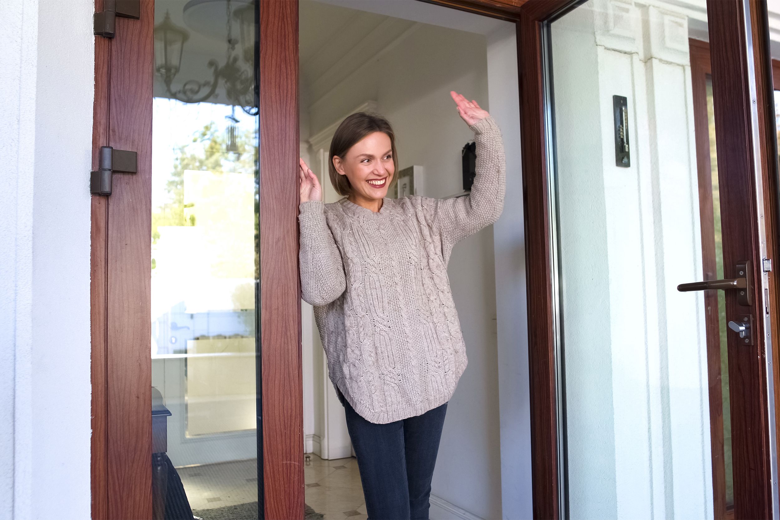Woman waving goodbye