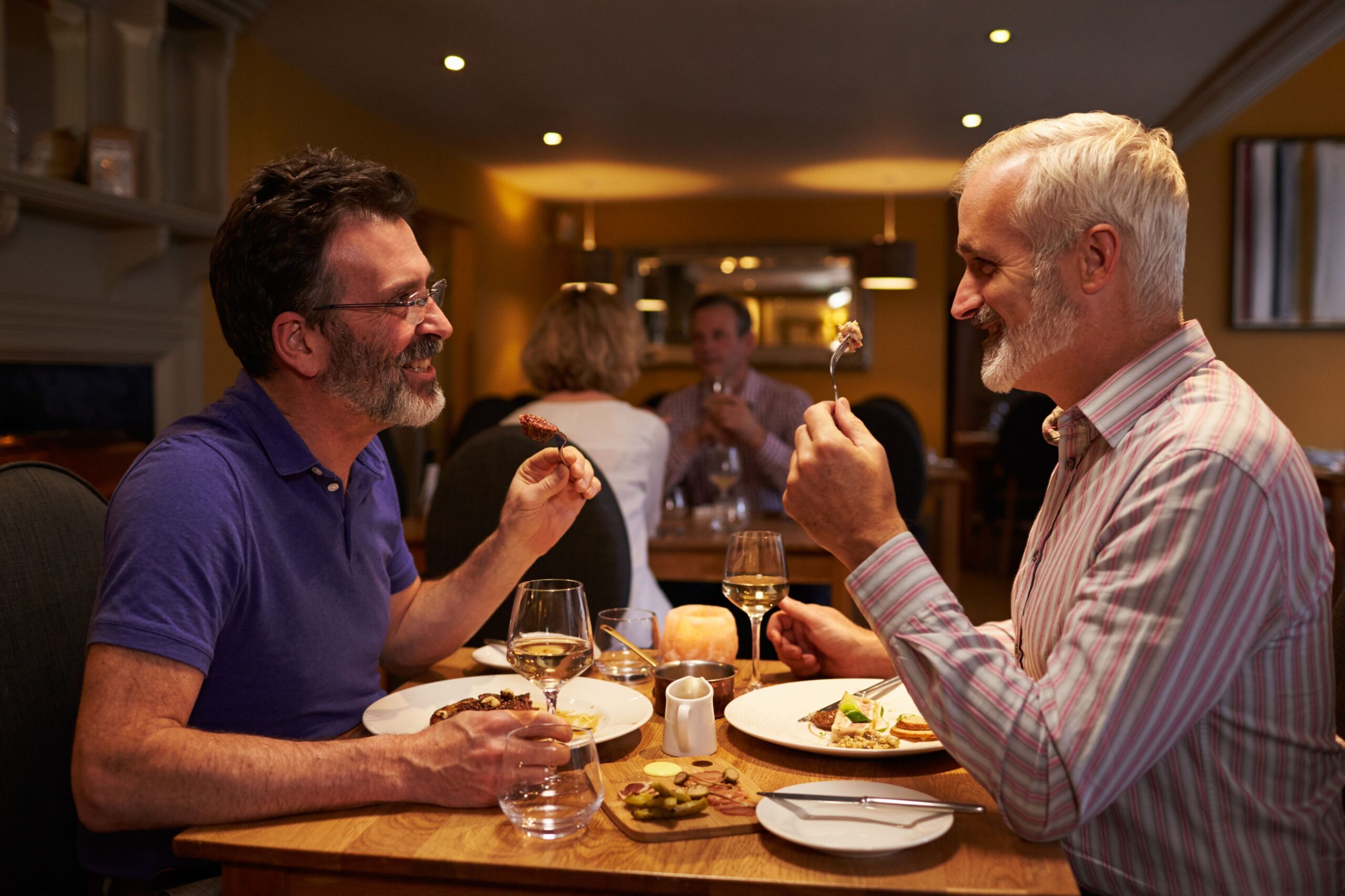 Two men on a date at a restaurant
