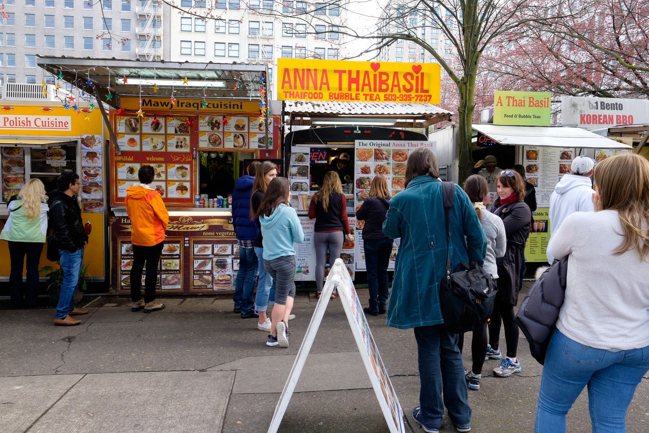 People waiting in line to order food at a food truck in Portland Oregon.