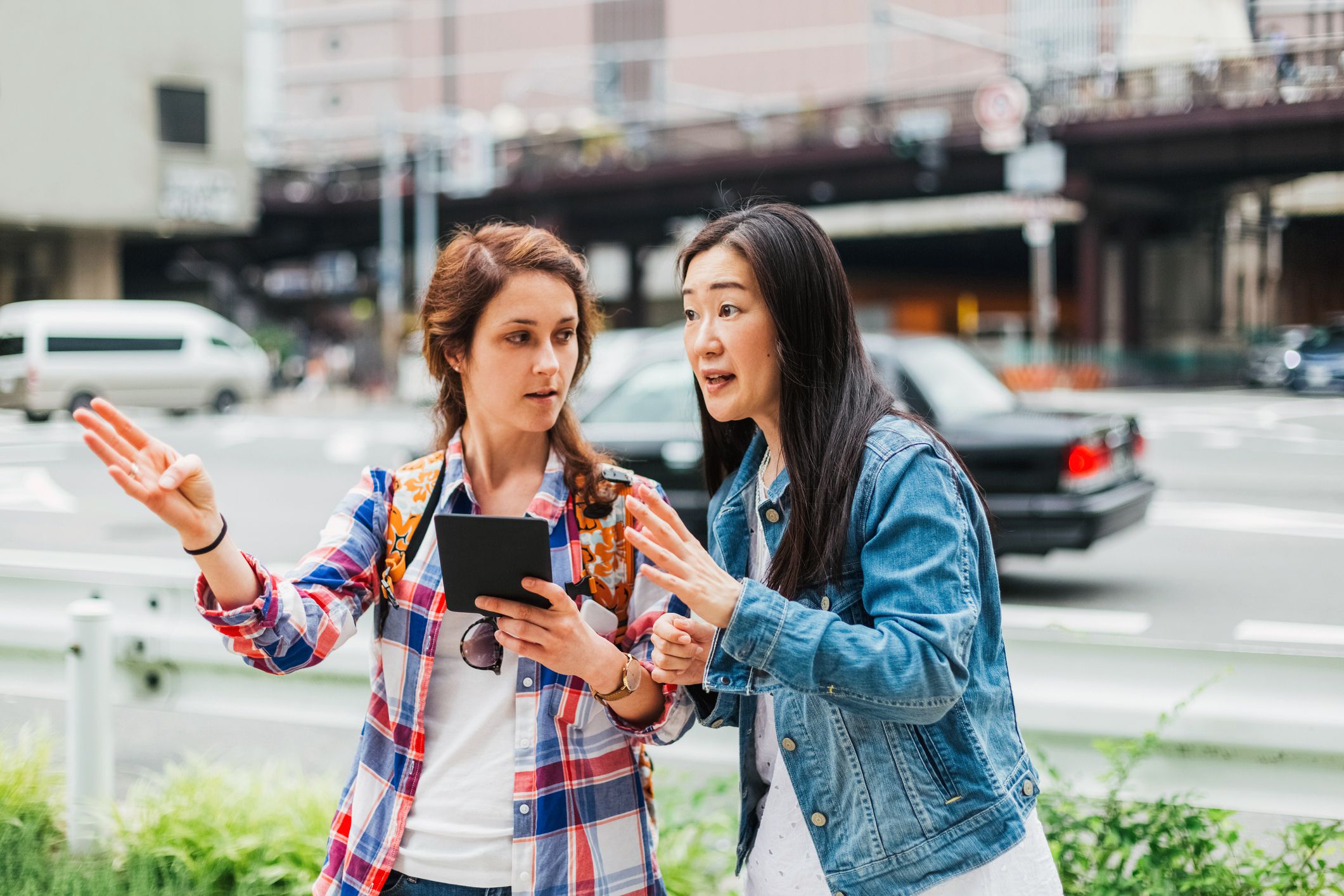 woman giving another woman directions