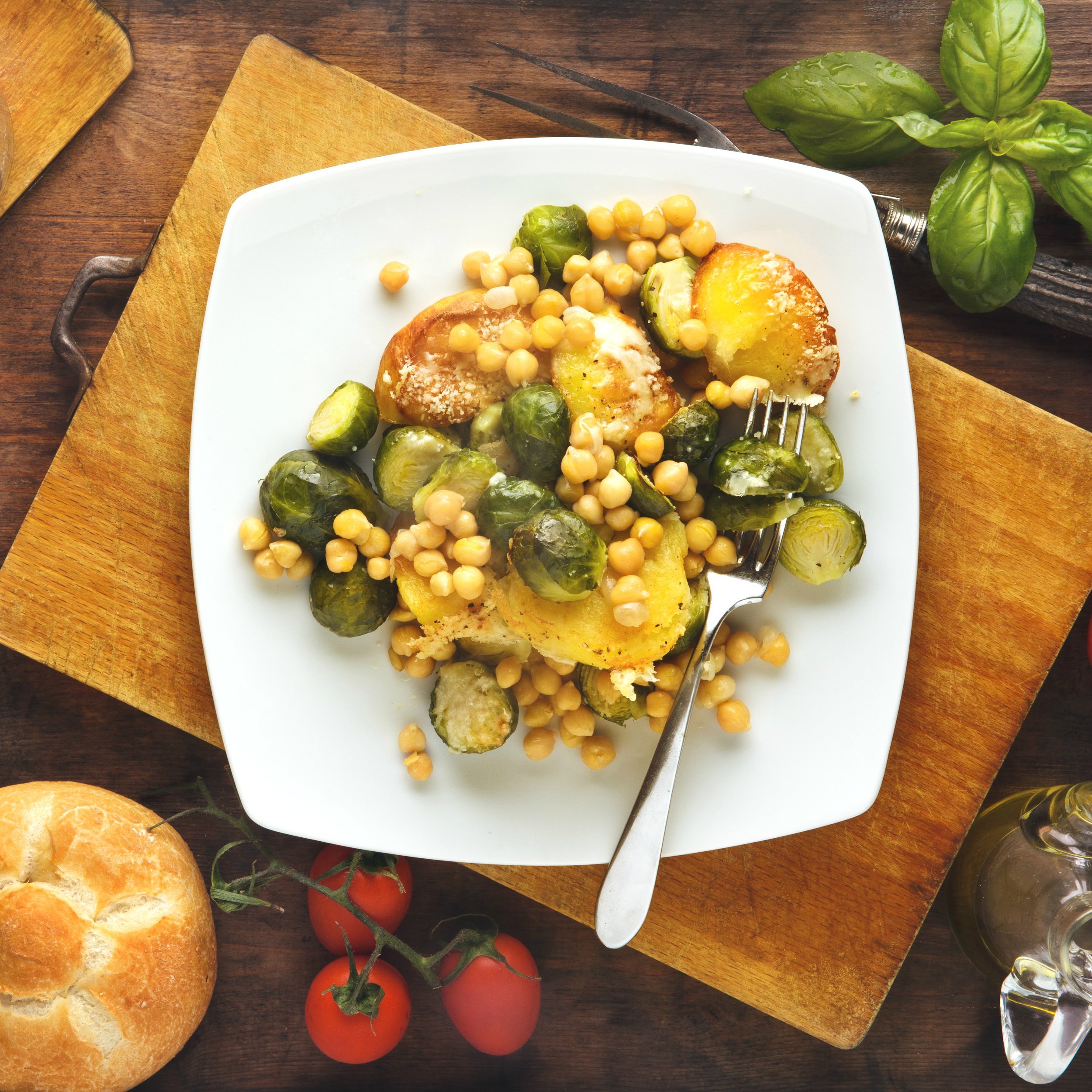 hot vegetable salad: baked potatoes, brussels sprouts and chickpeas with parmesan cheese.