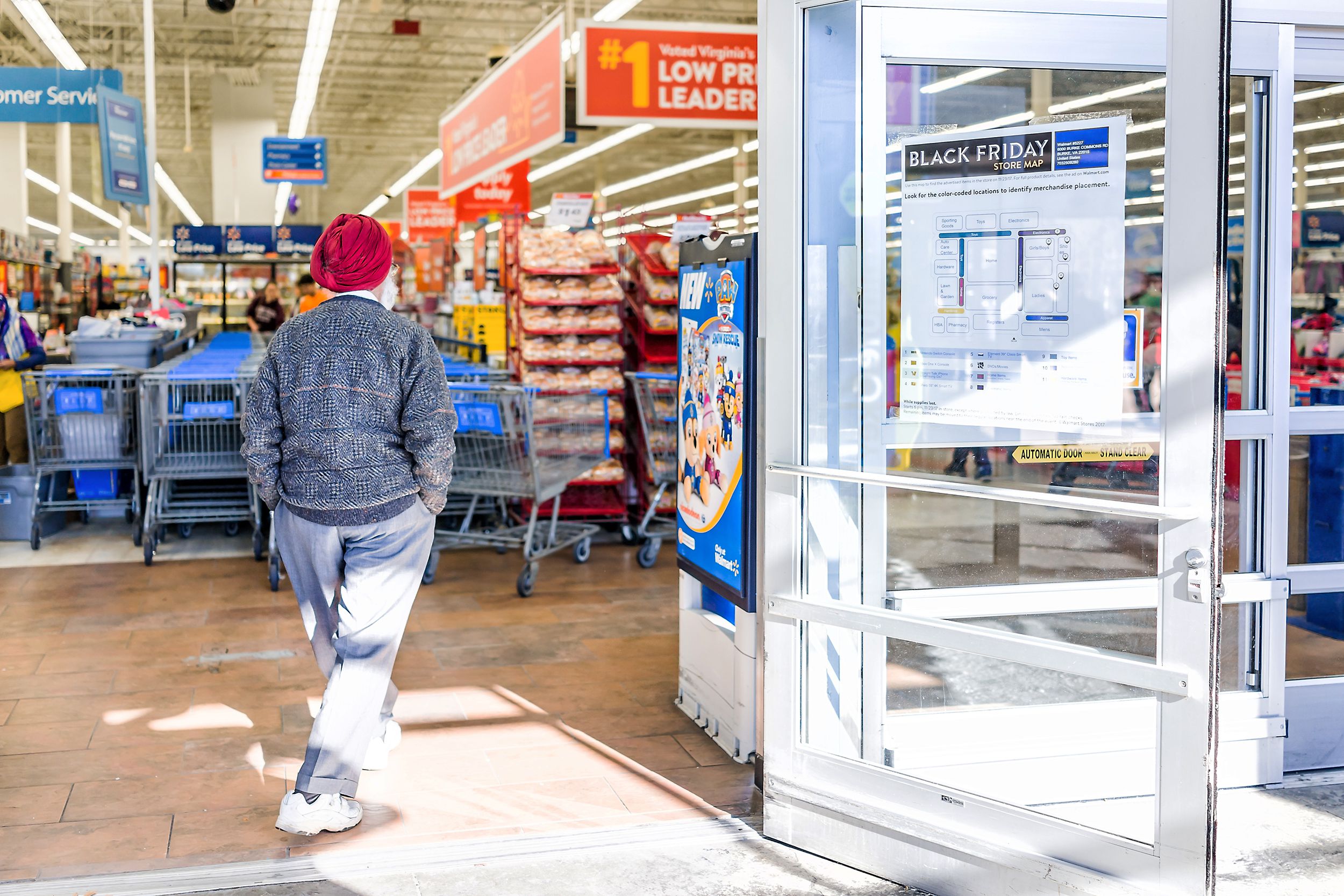 man walking into Walmart