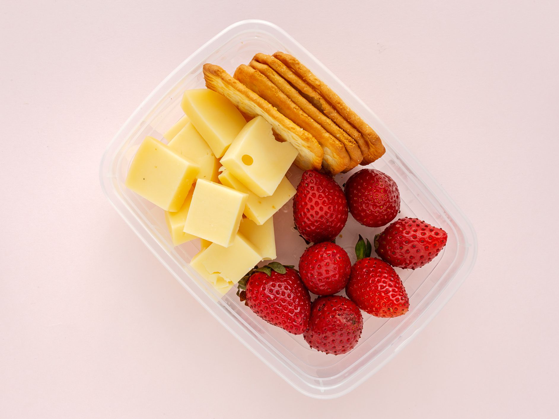Food in Plastic containers ready to eat from above To take away. On pink background. Healthy food. Vegan food. Flat lay