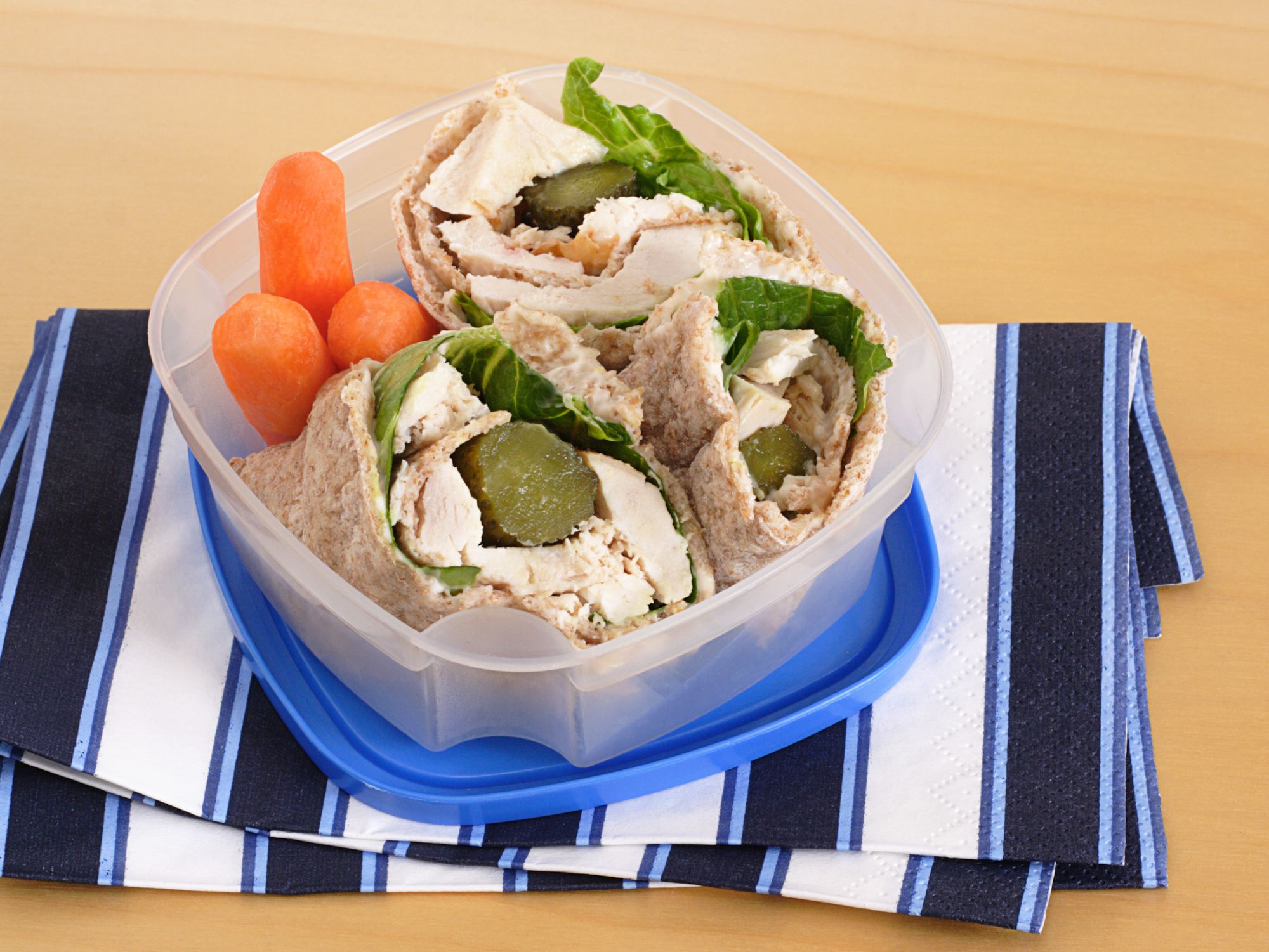 Roasted chicken rolled with pickles in whole wheat pita for a healthy snack or lunch