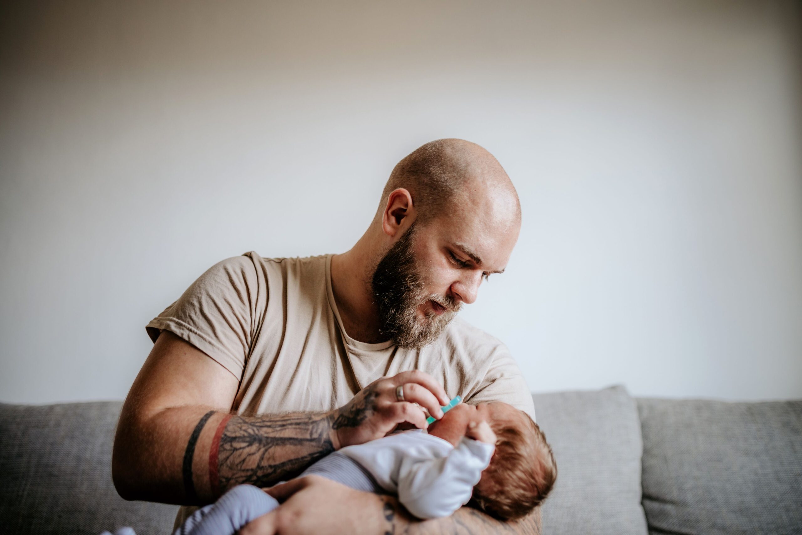 father holding baby