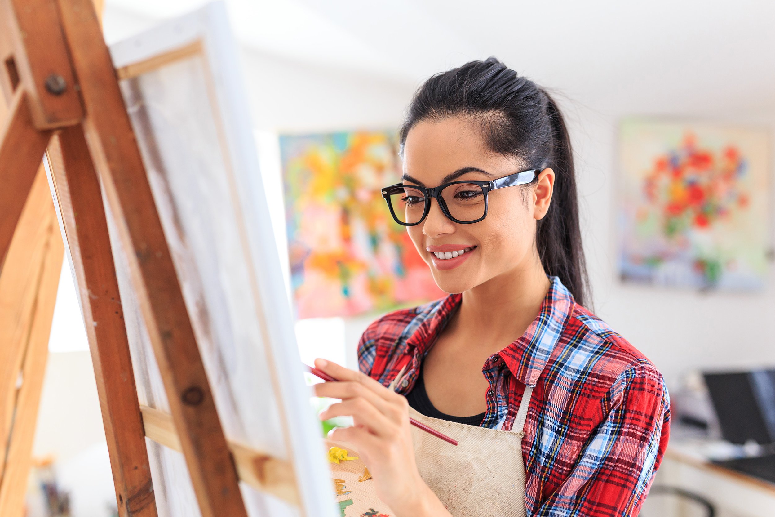 woman painting in home
