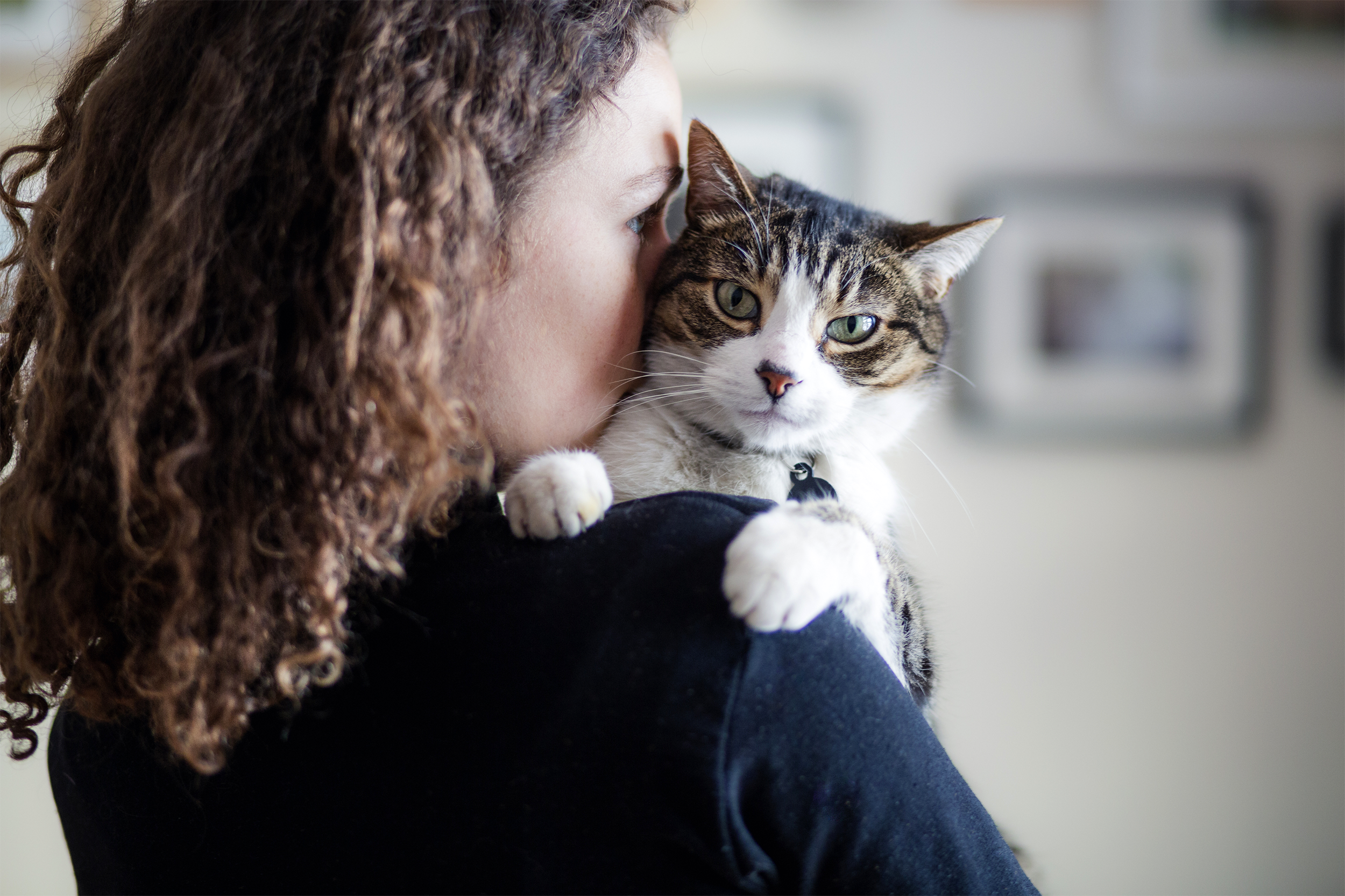 Woman holding her cat
