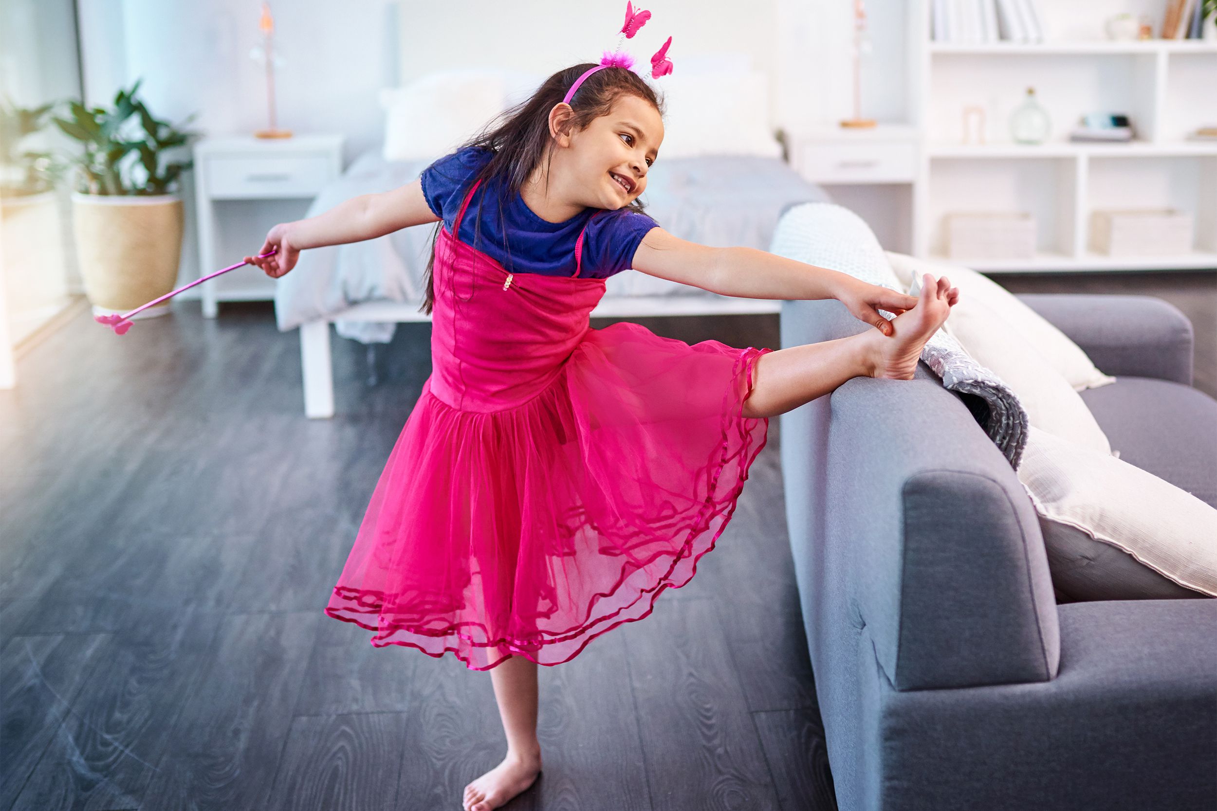 young girl dancing in living room