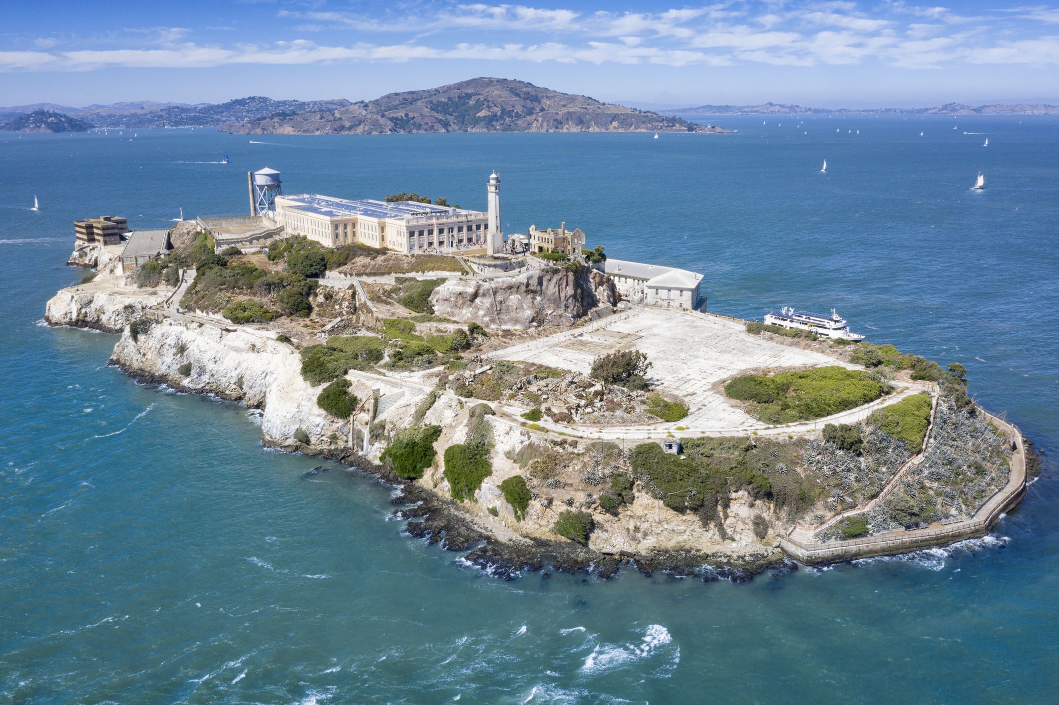 Aerial of the famous Island Alcatraz by San Francisco in front of the Golden Gate Bridge. California, USA.