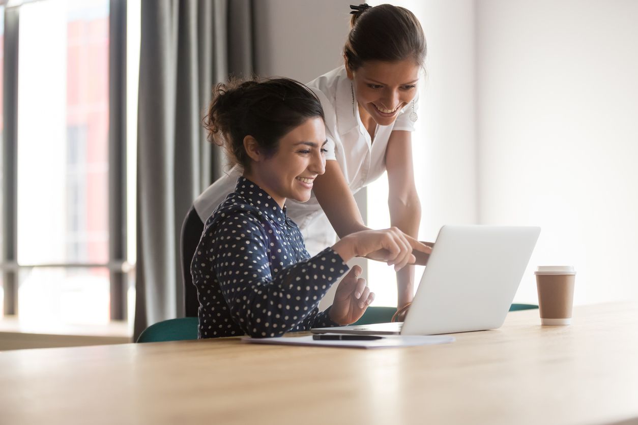 friends looking at computer