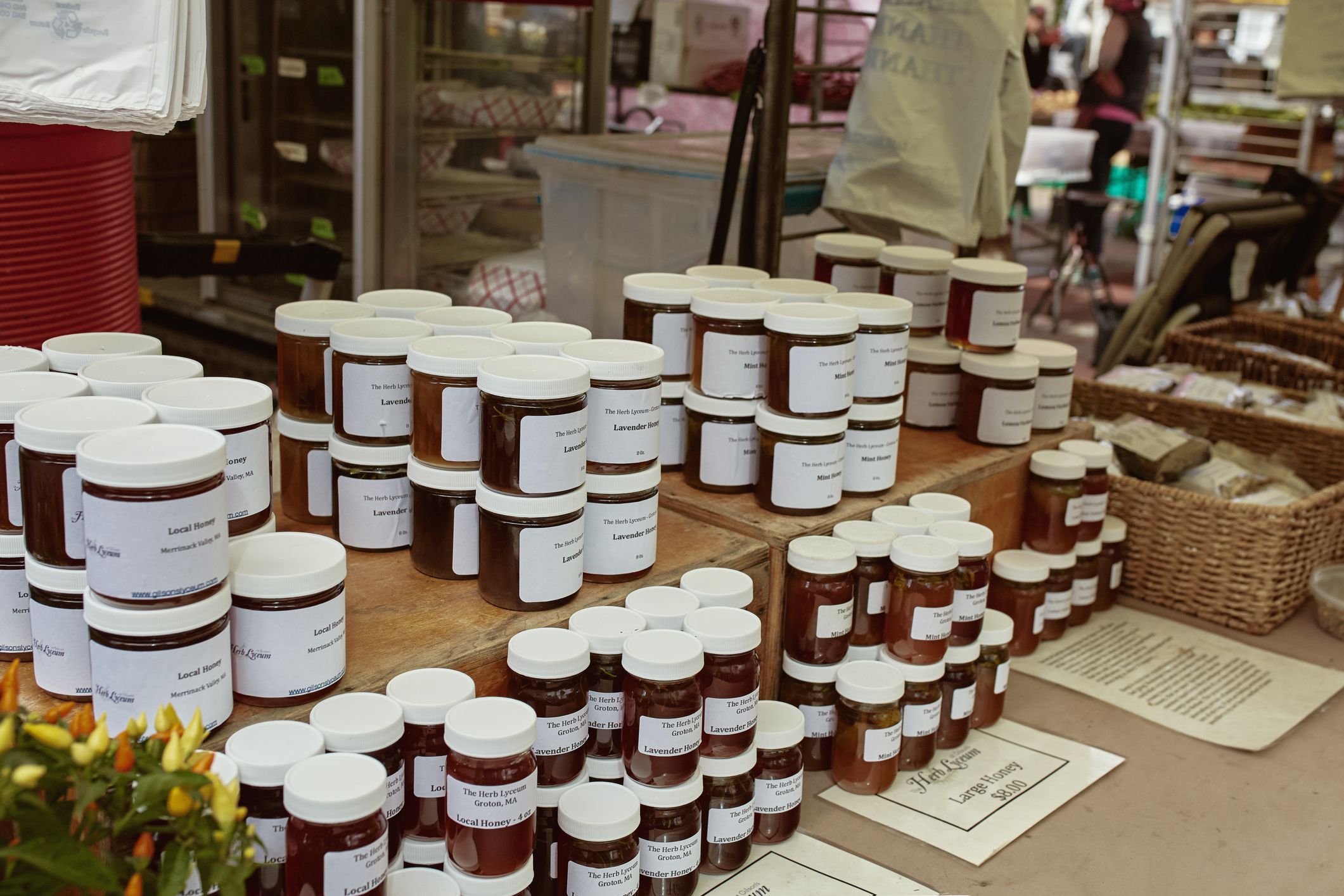 Boston, Massachusetts - October 3rd, 2019: Variety of local honey for sale at a farmers market in Copley Square on a Fall day.