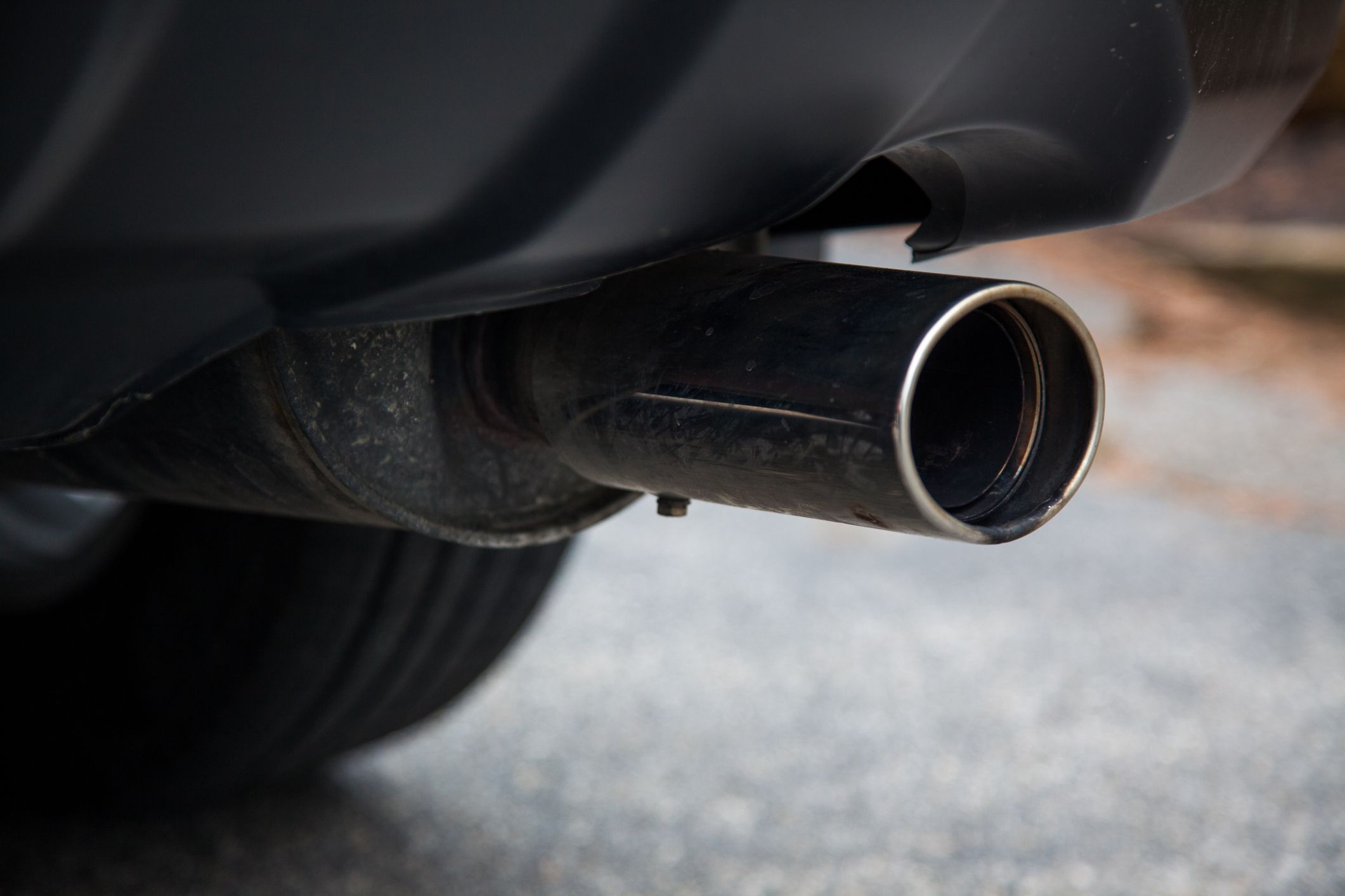 A gas muffler on a car