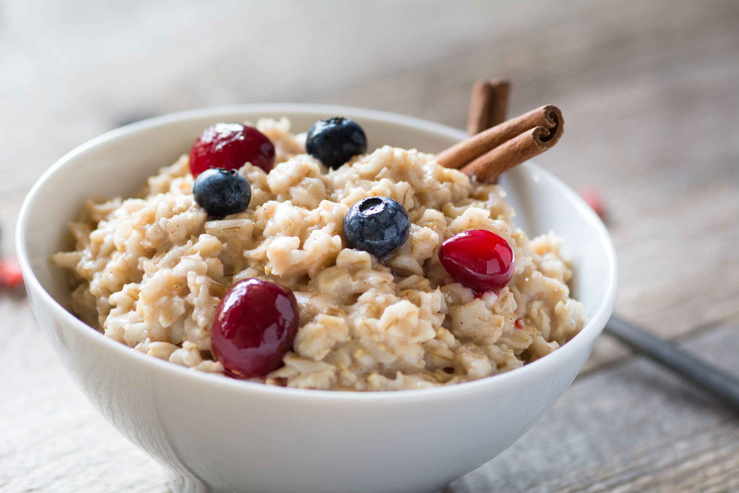 breakfast oatmeal porridge with berries in bowl
