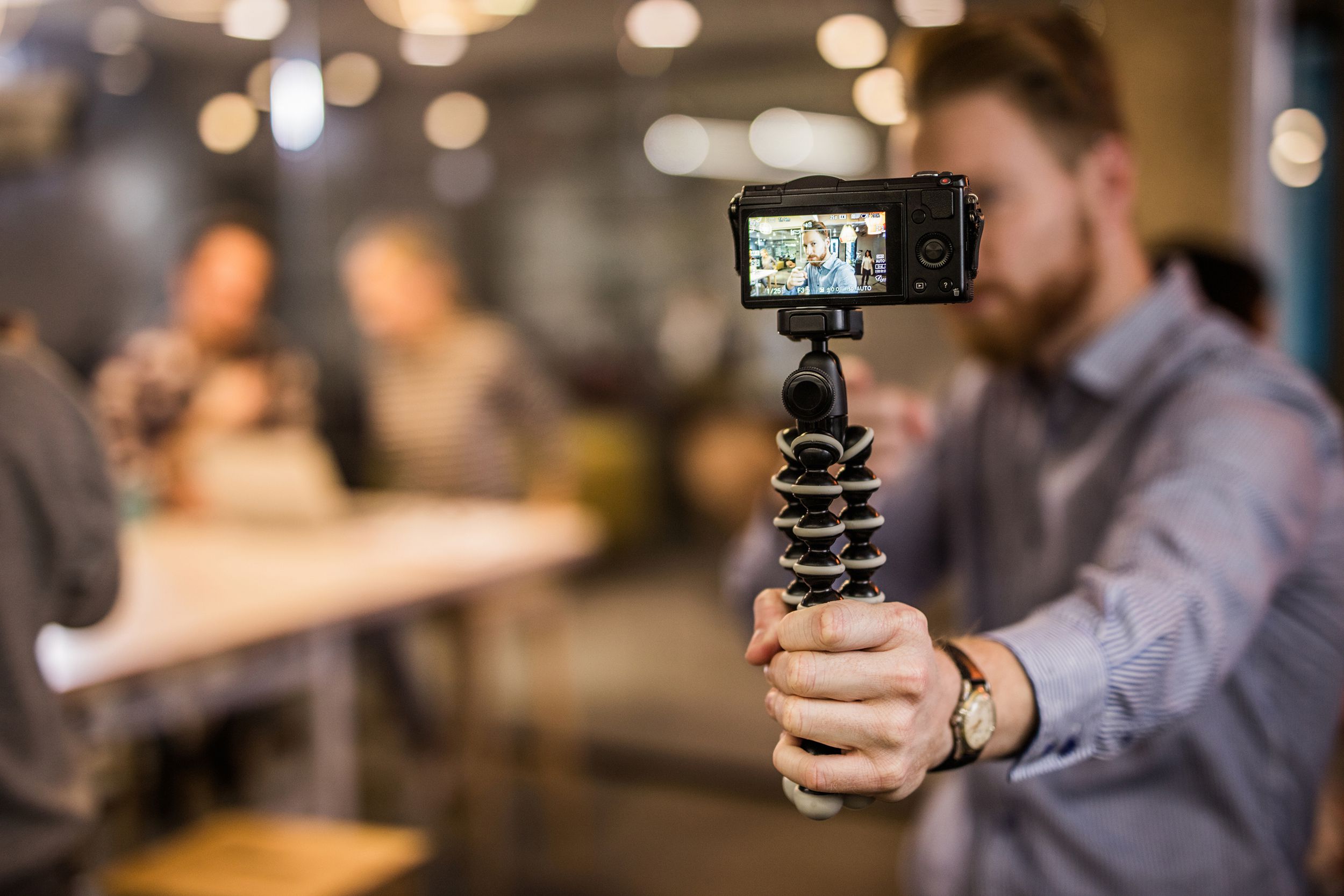 close up of redhead man making reportage by vlogging