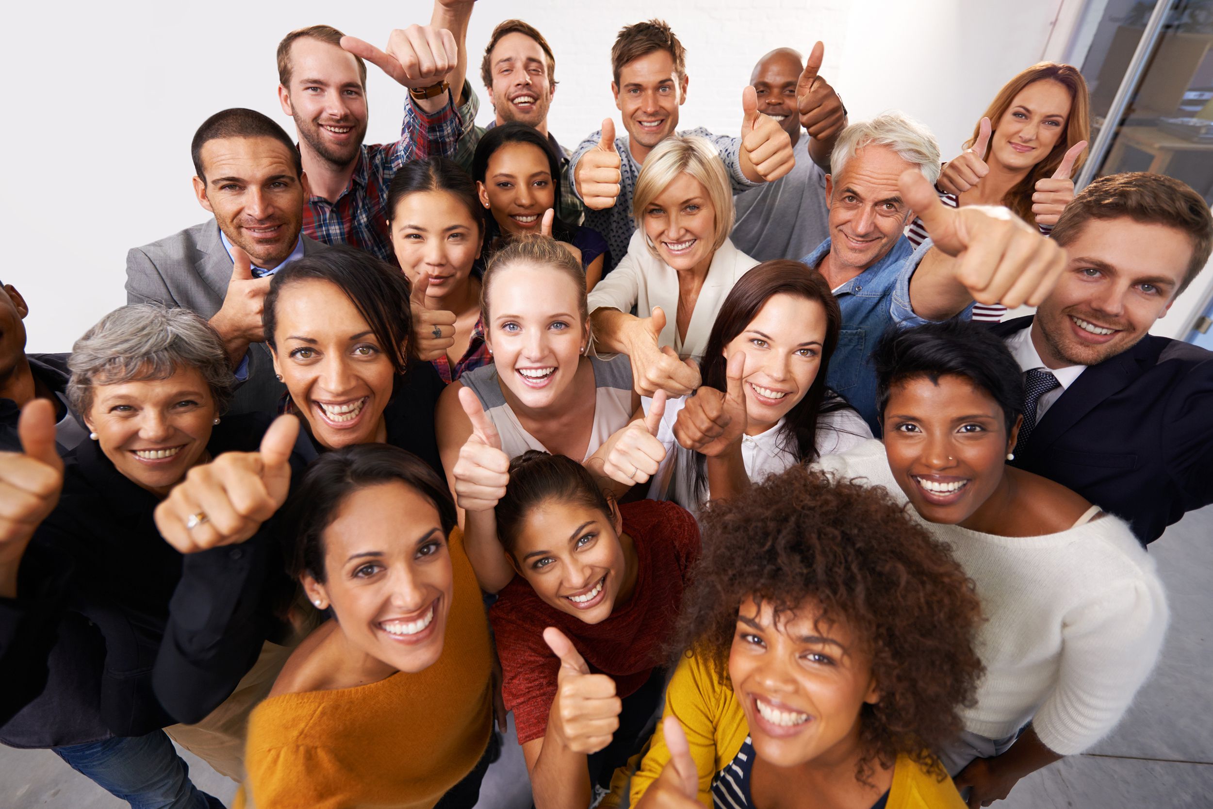 group of diverse professionals meeting, giving camera thumbs up