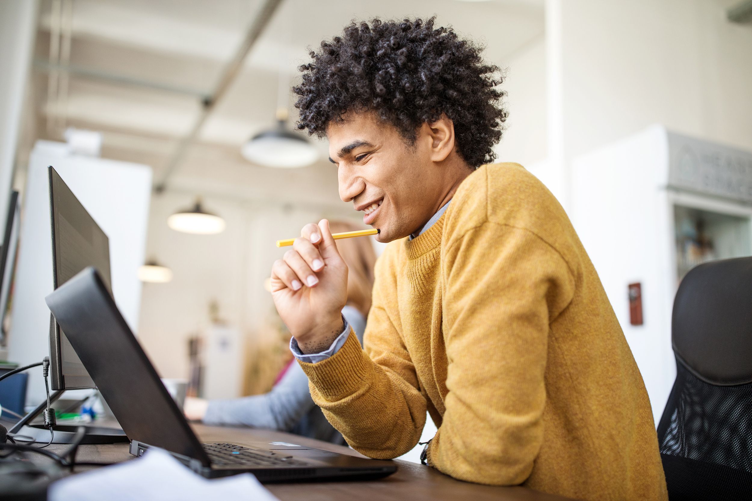 smiling businessman working at his desk