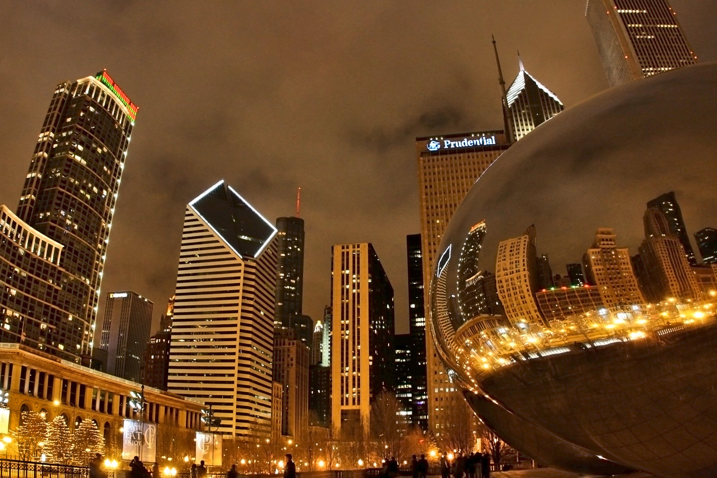 lights of skyscrapers reflected in Cloud Gate, Millennium park