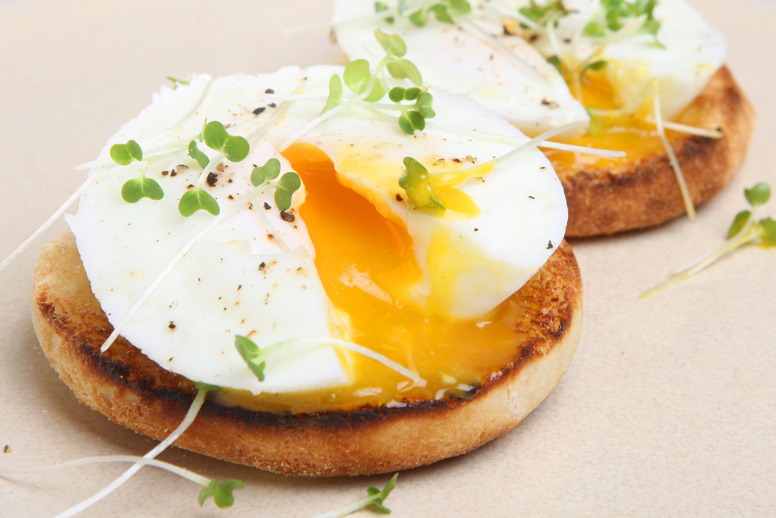 Two poached eggs on English muffins