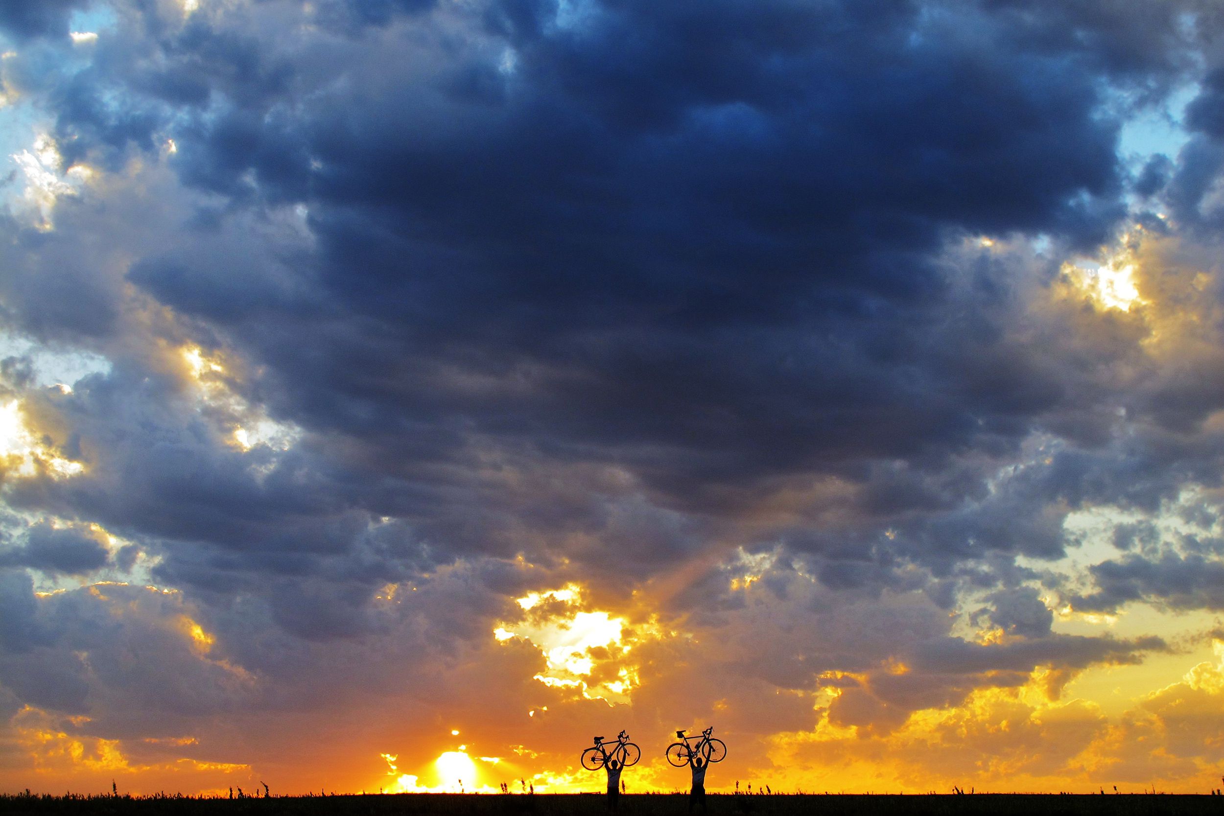 two cyclists during sunset, Kansas