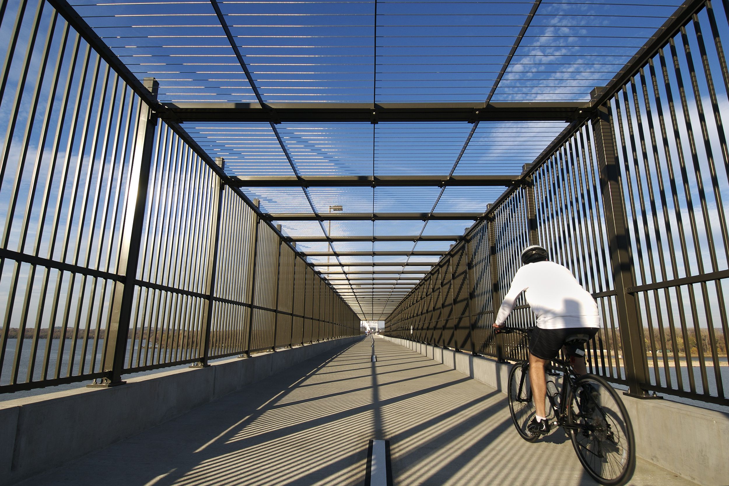 person biking through Big Dam Bridge, Little Rock, Arkansas