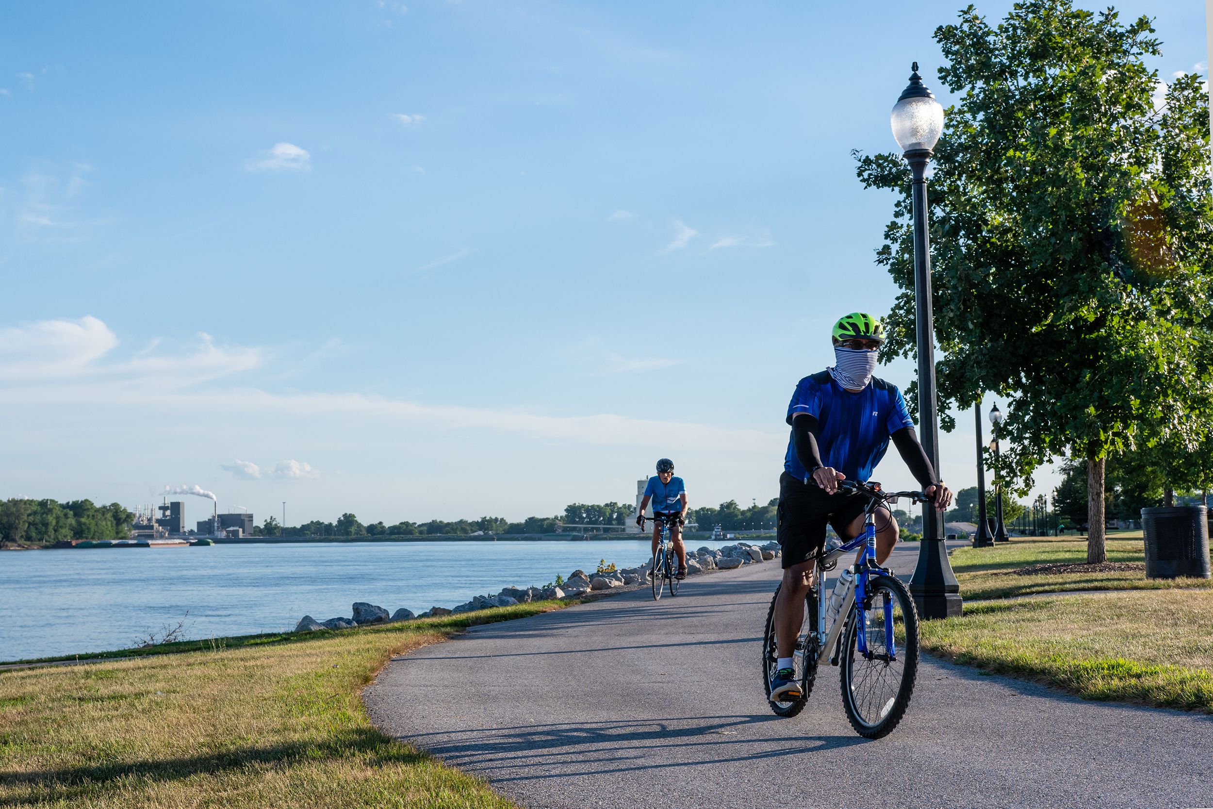 two men getting exercise by riding bikes on a bike, Muscatine, Iowa