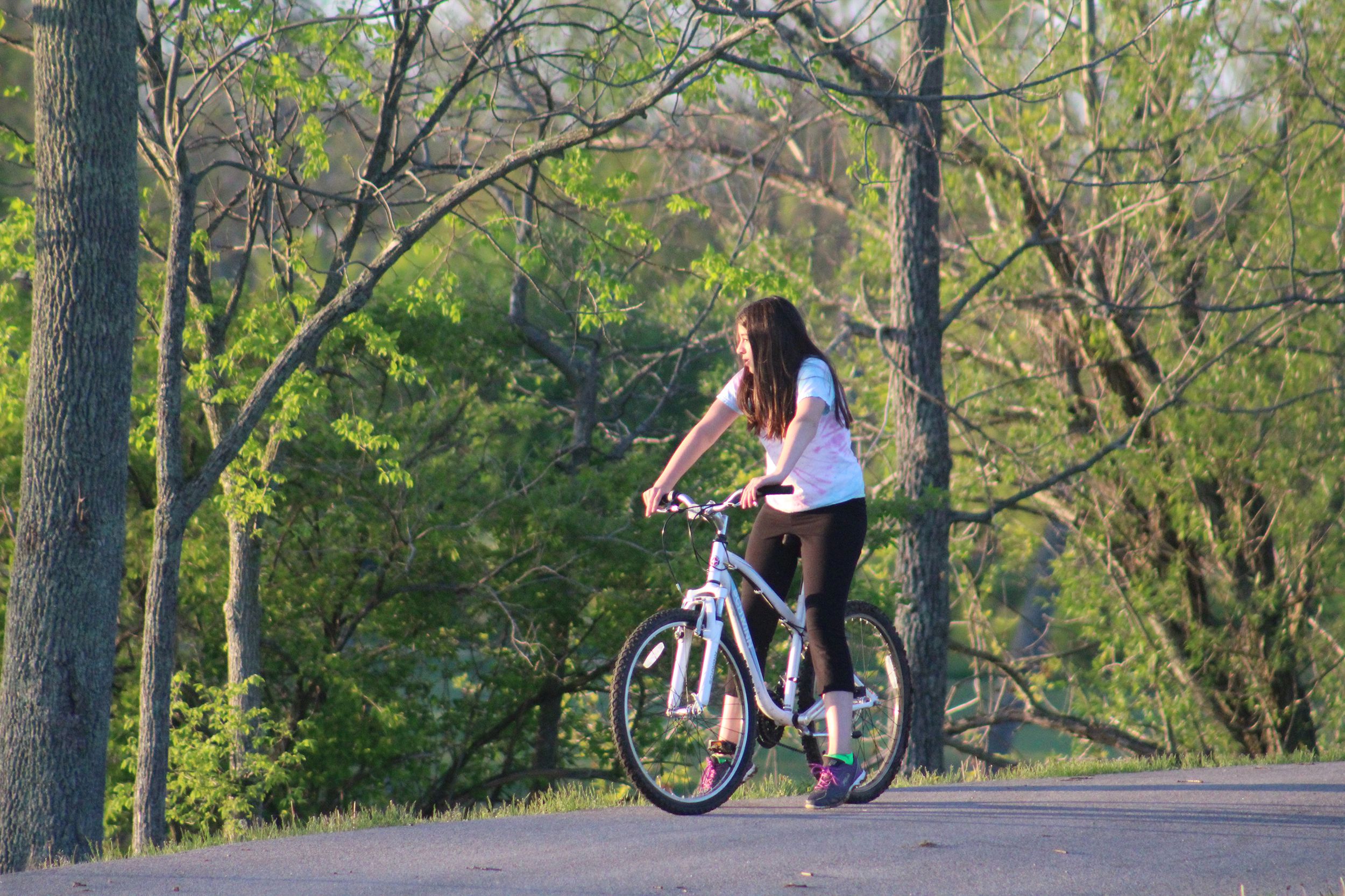 young girl rides bicycle at Jacobson Park, Lexington, Kentucky