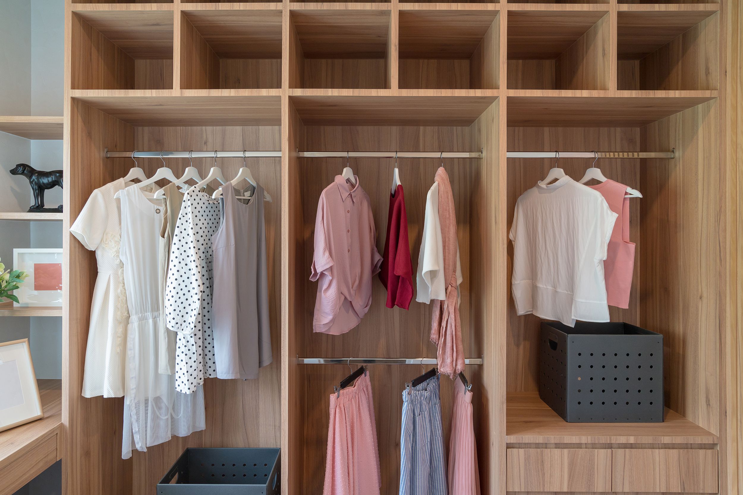 modern closet with clothes hanging on rail