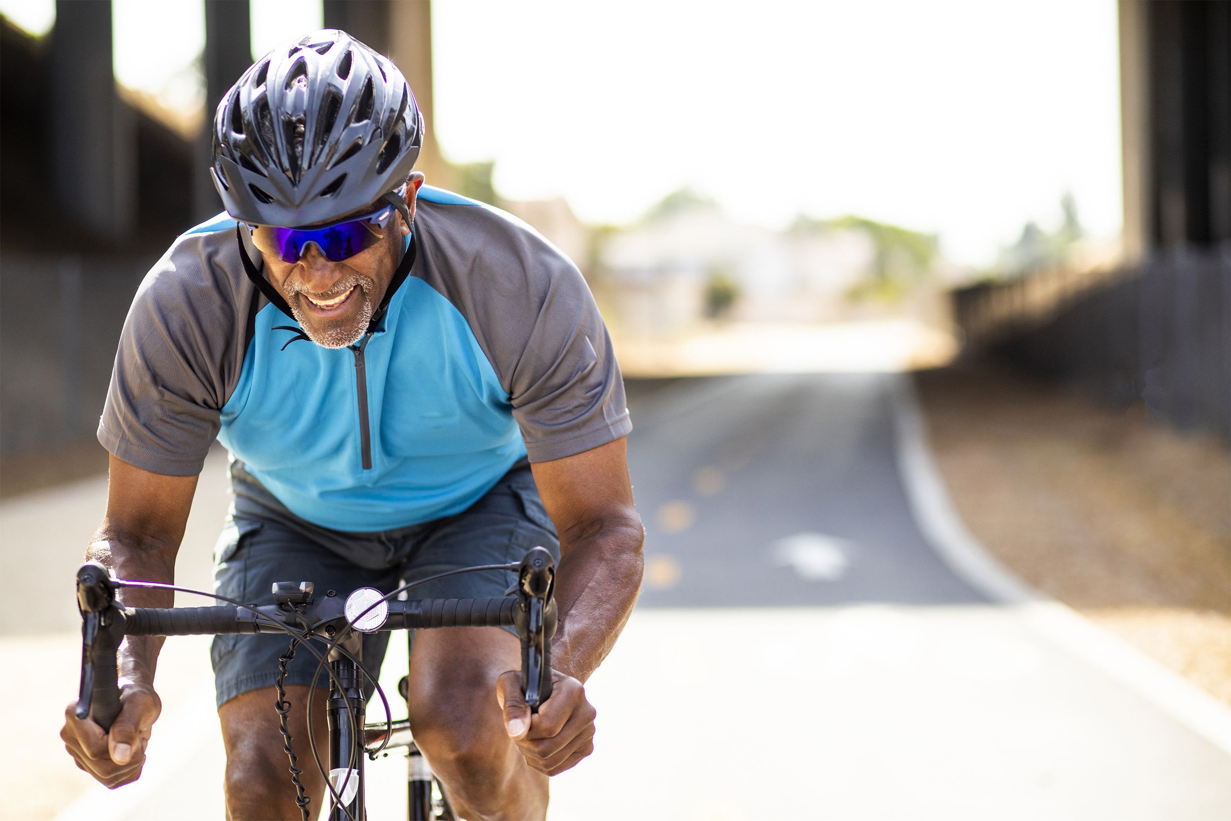 Older man biking outside