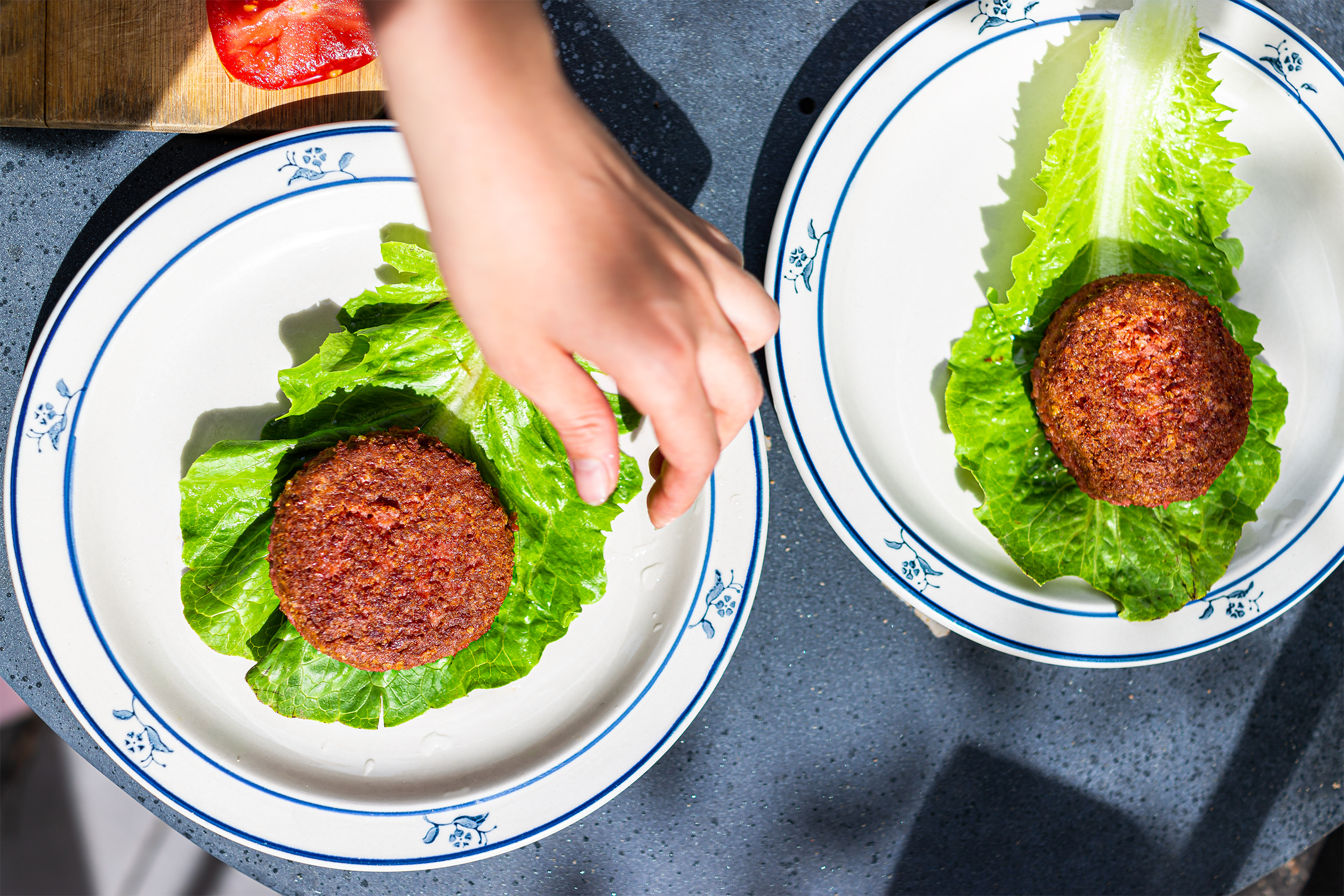 vegan meat patties on lettuce