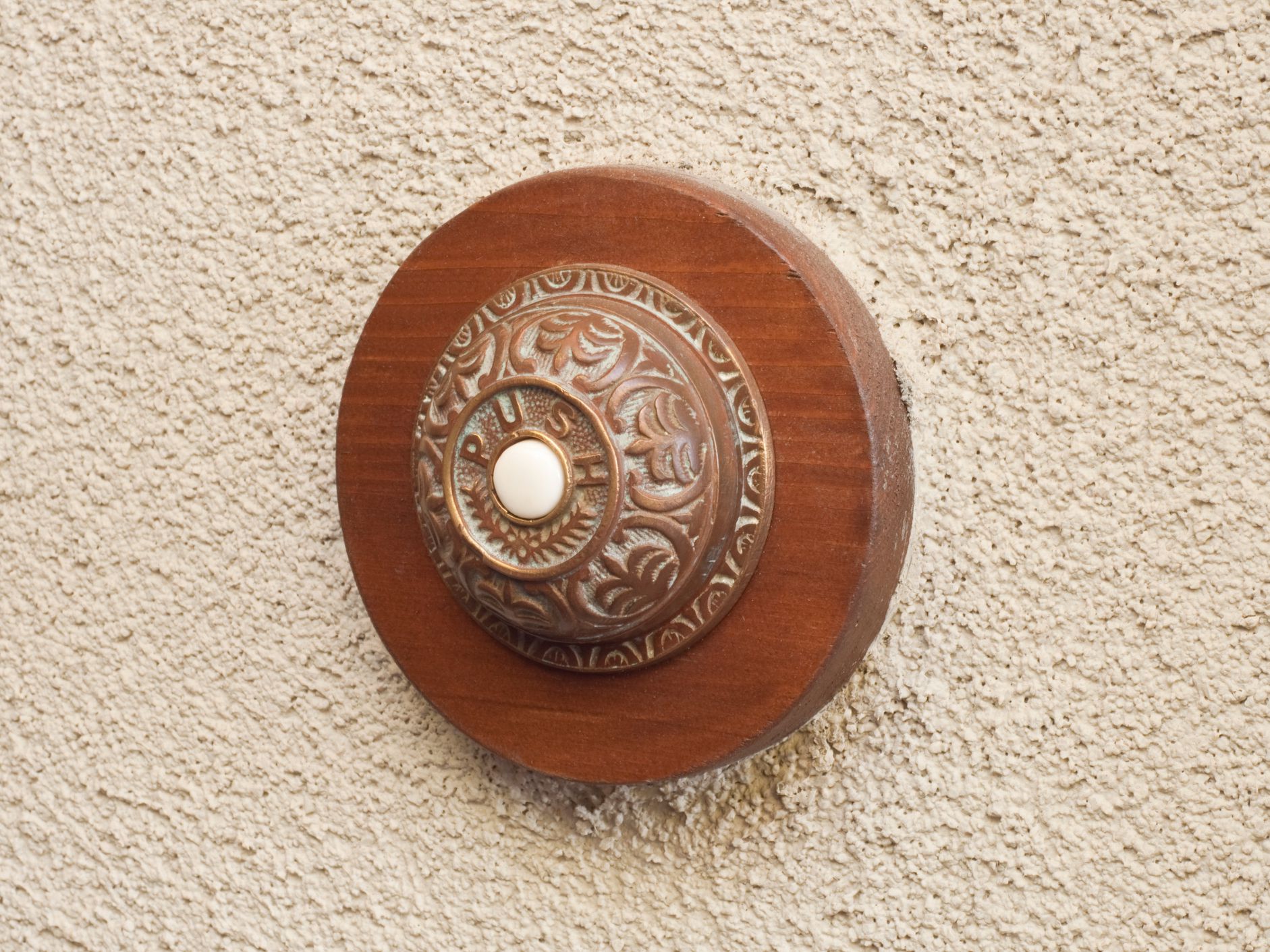 This close up of a old fashion doorbell give you great detail.