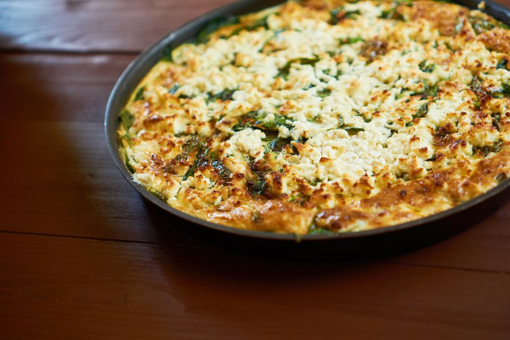 ttata in a pan, on a rustic wooden table ready to serve