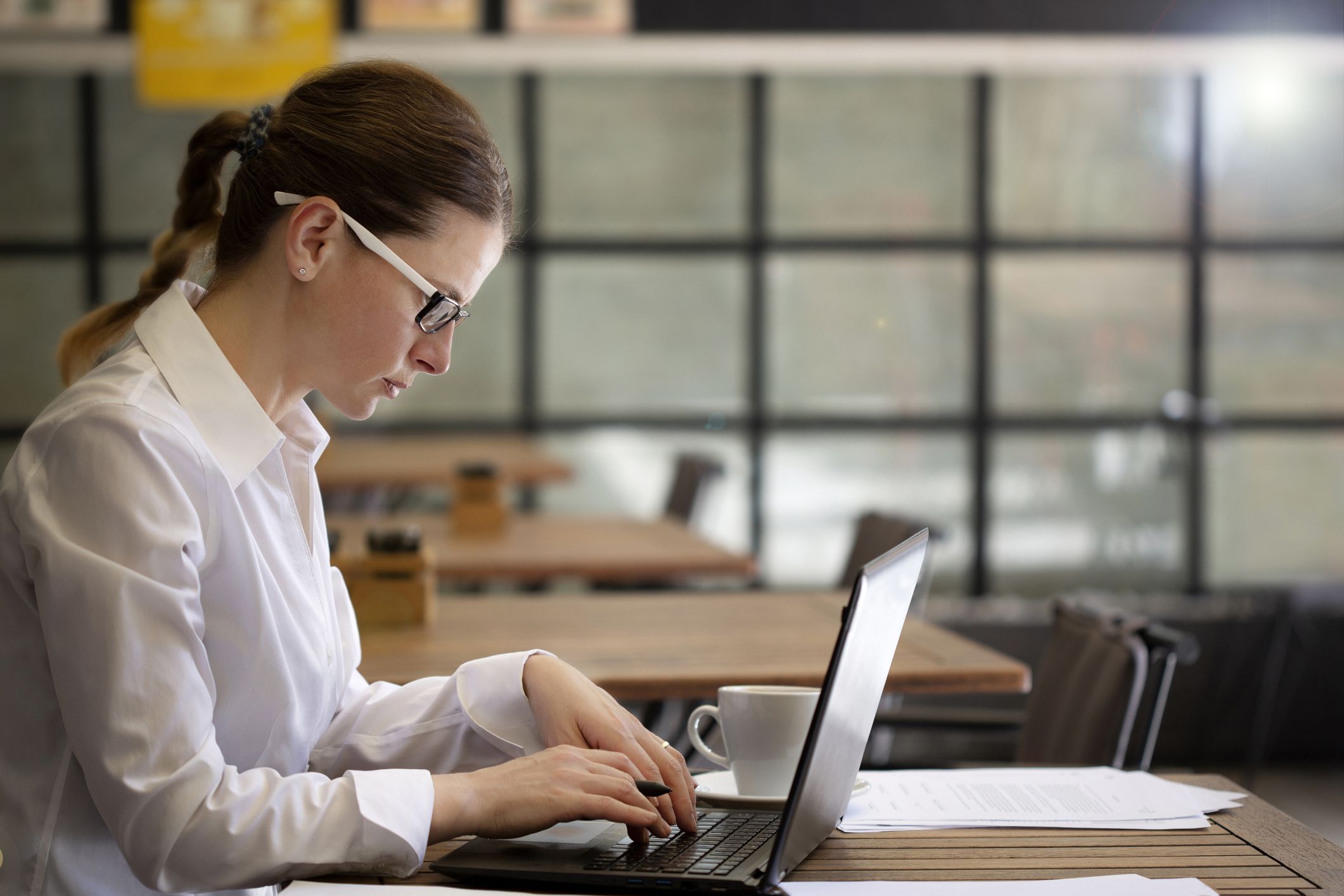 young woman working at cafe