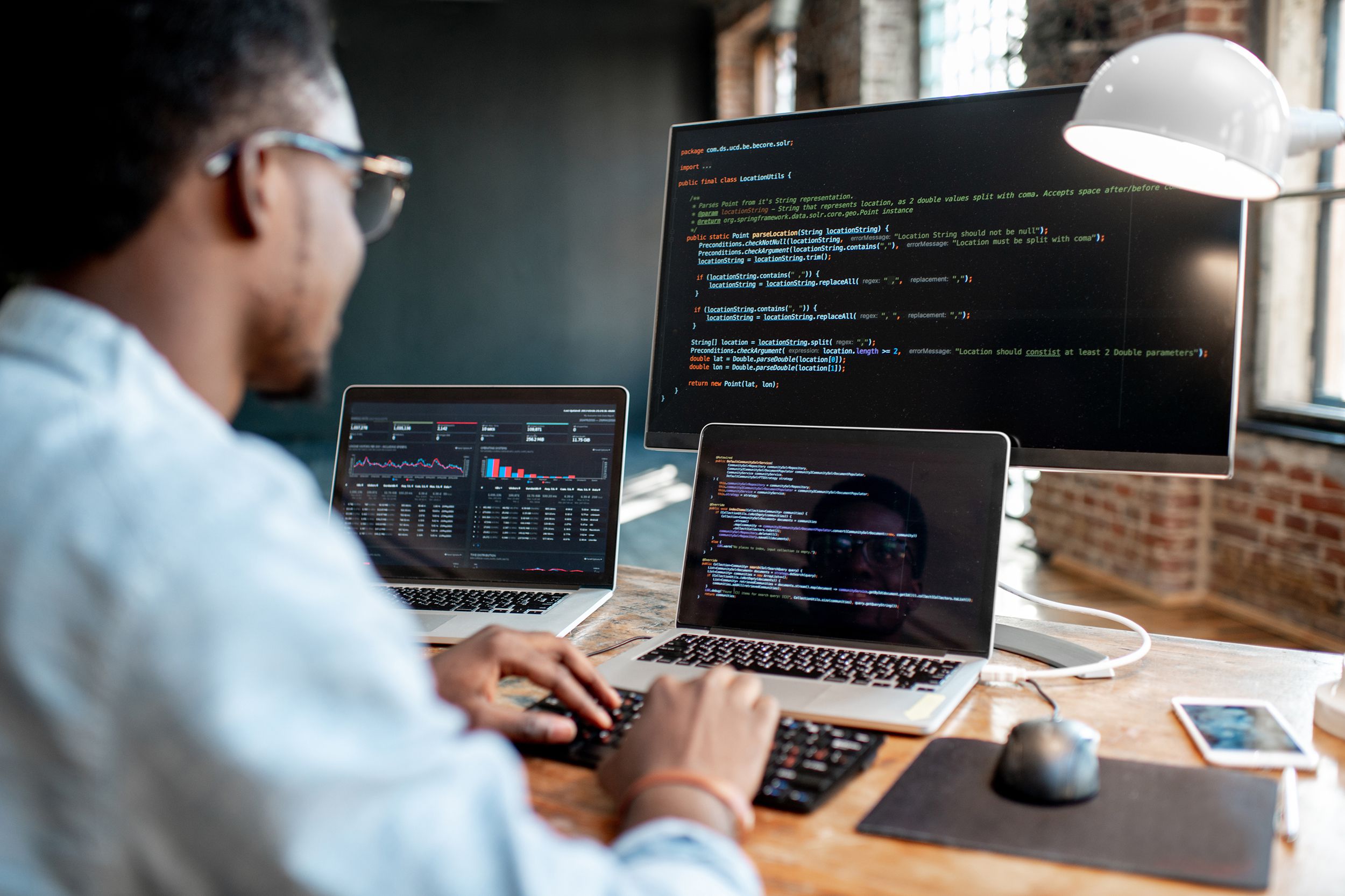 programmer working with program code in office