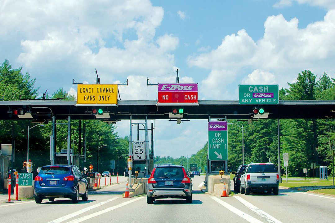 A New Hampshire E-ZPass plaza also using a coin drop basket (left) and a conventional toll booth (right)