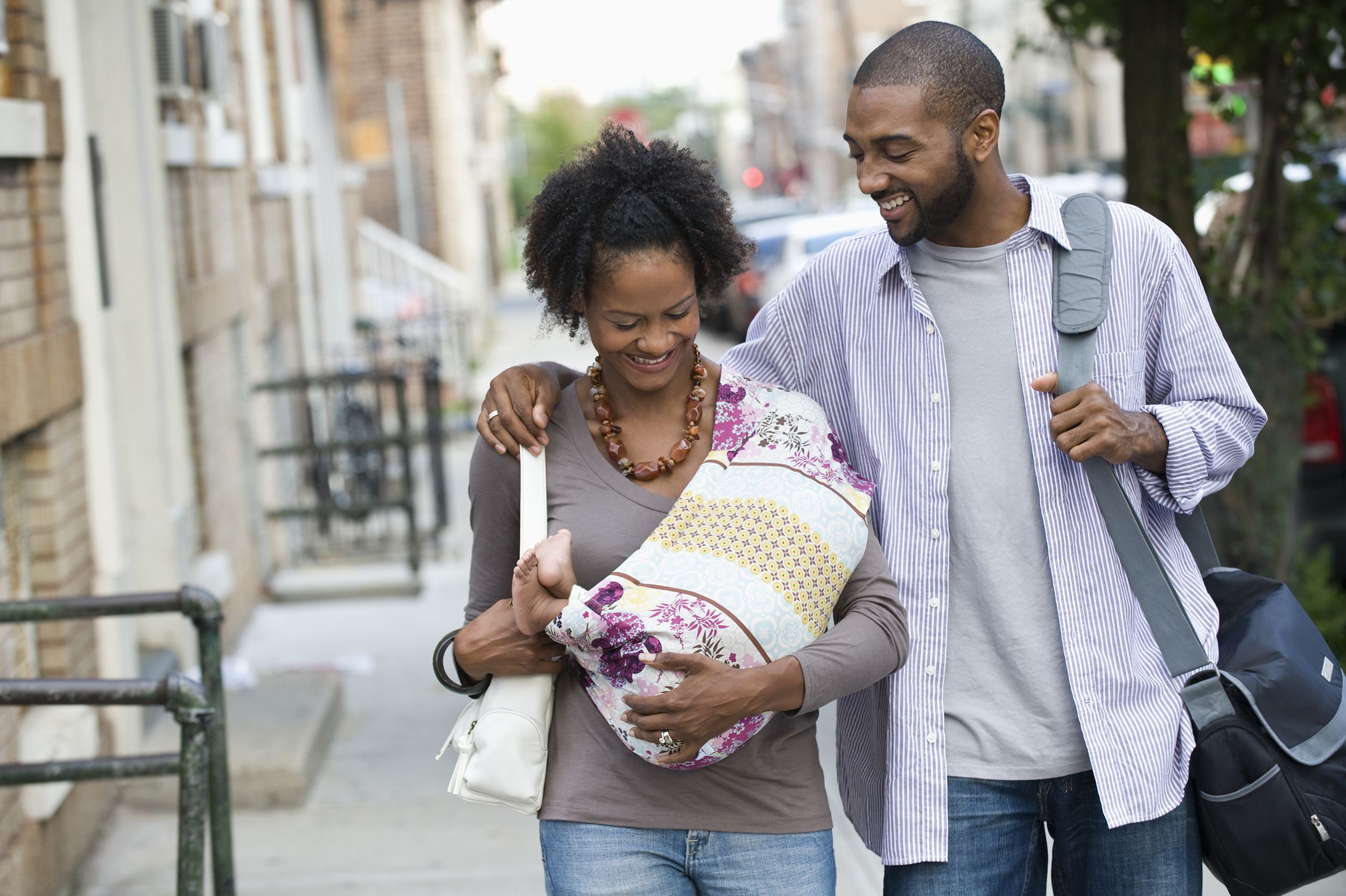 couple with baby out walking, West New York, New Jersey