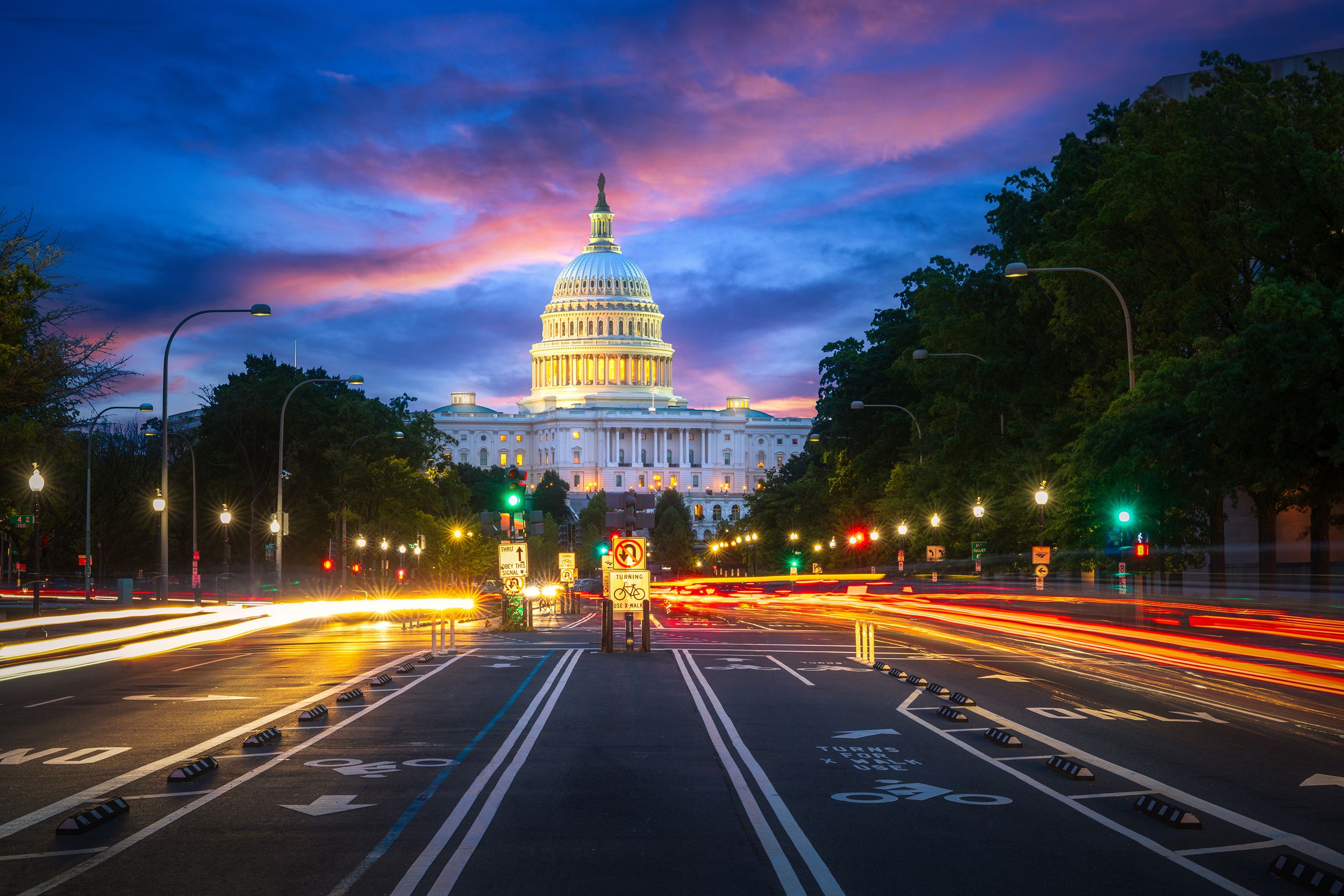 capital building in Washington D.C. city at night wiht street and cityscape