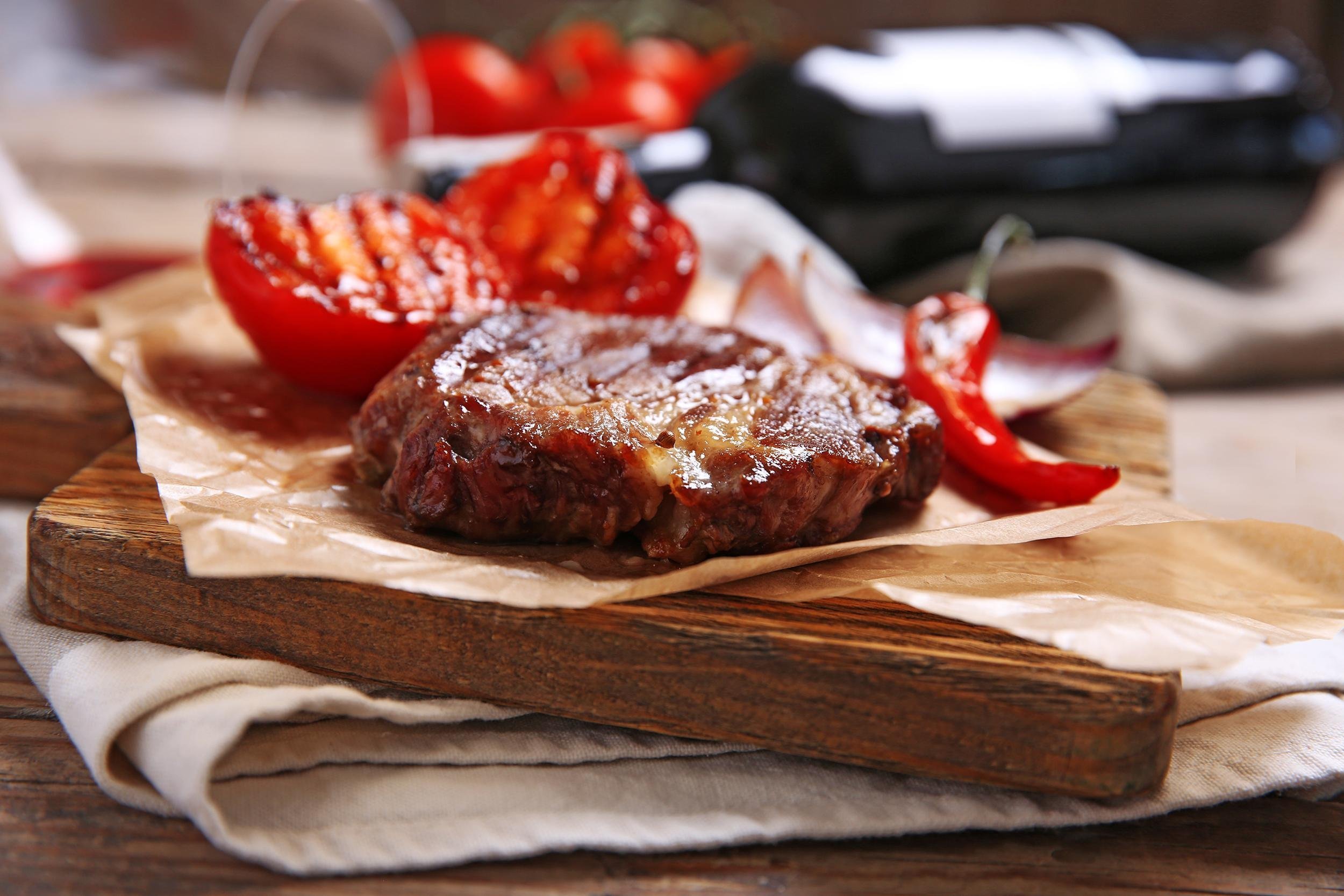 roasted beef fillet and vegetables on cutting board