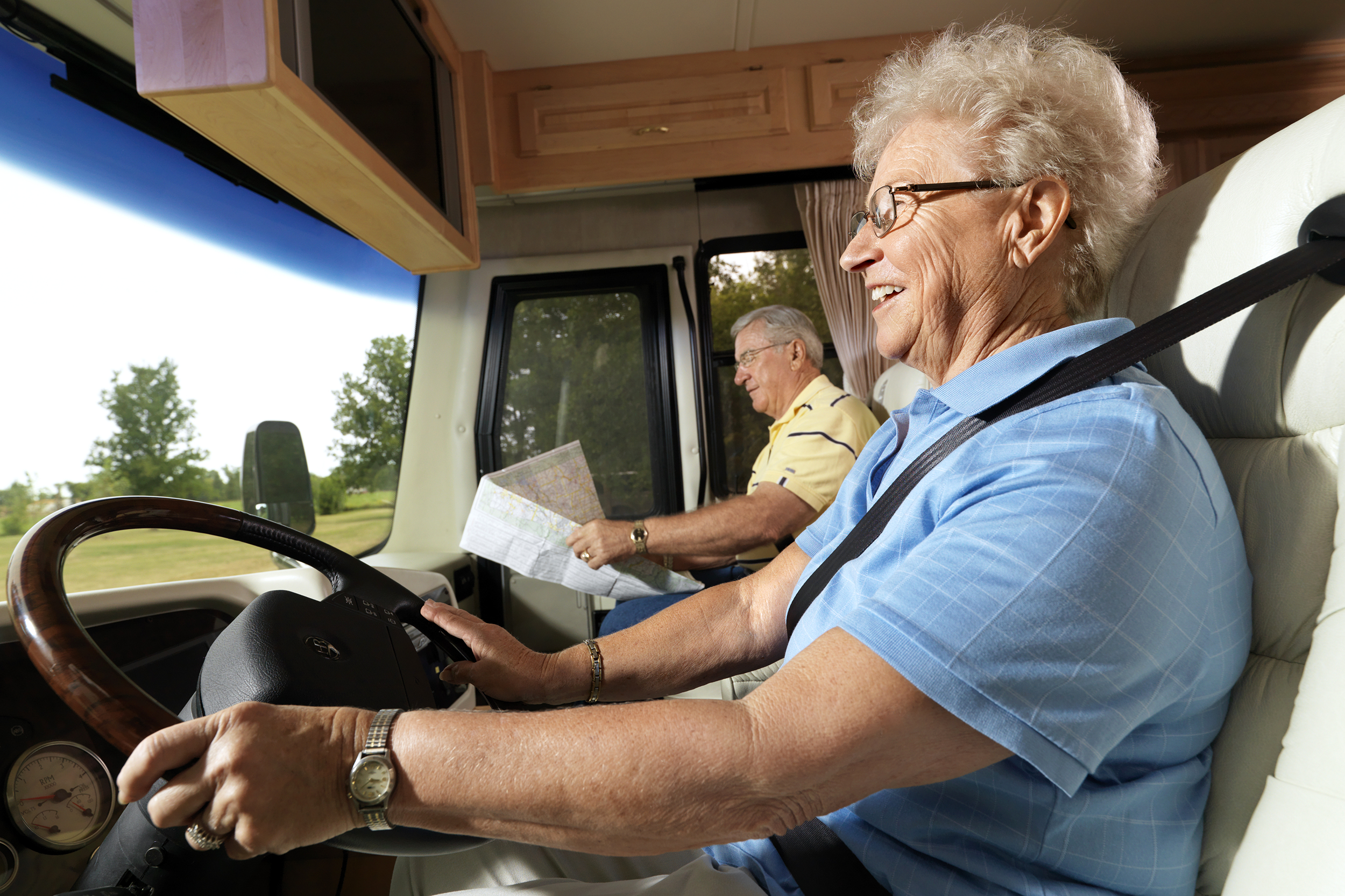 Senior couple driving an RV