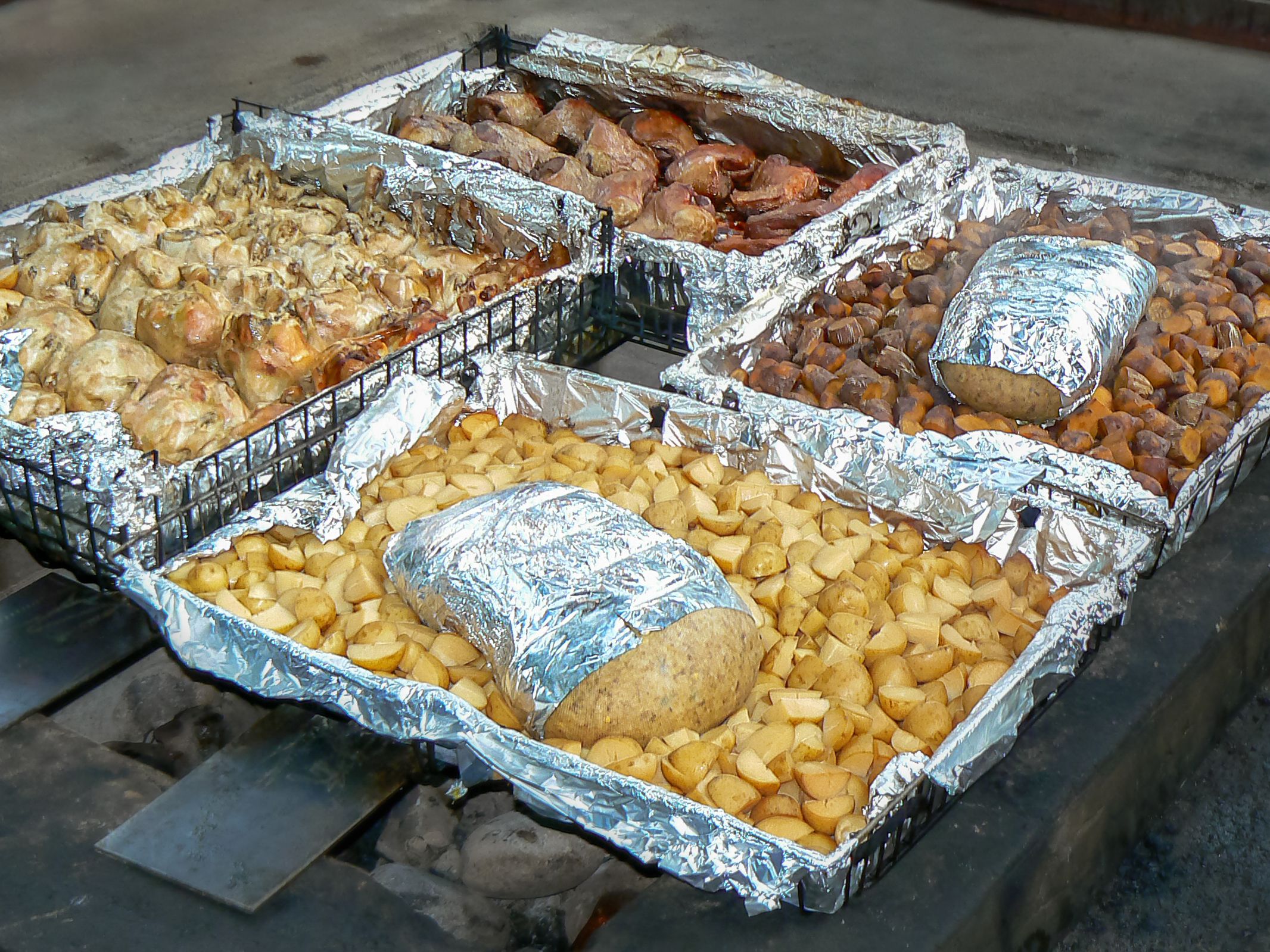 Traditionally cooked hangi meal, food cooked under the ground in an earth oven by Maori people, Rotorua, North Island, New Zealand
