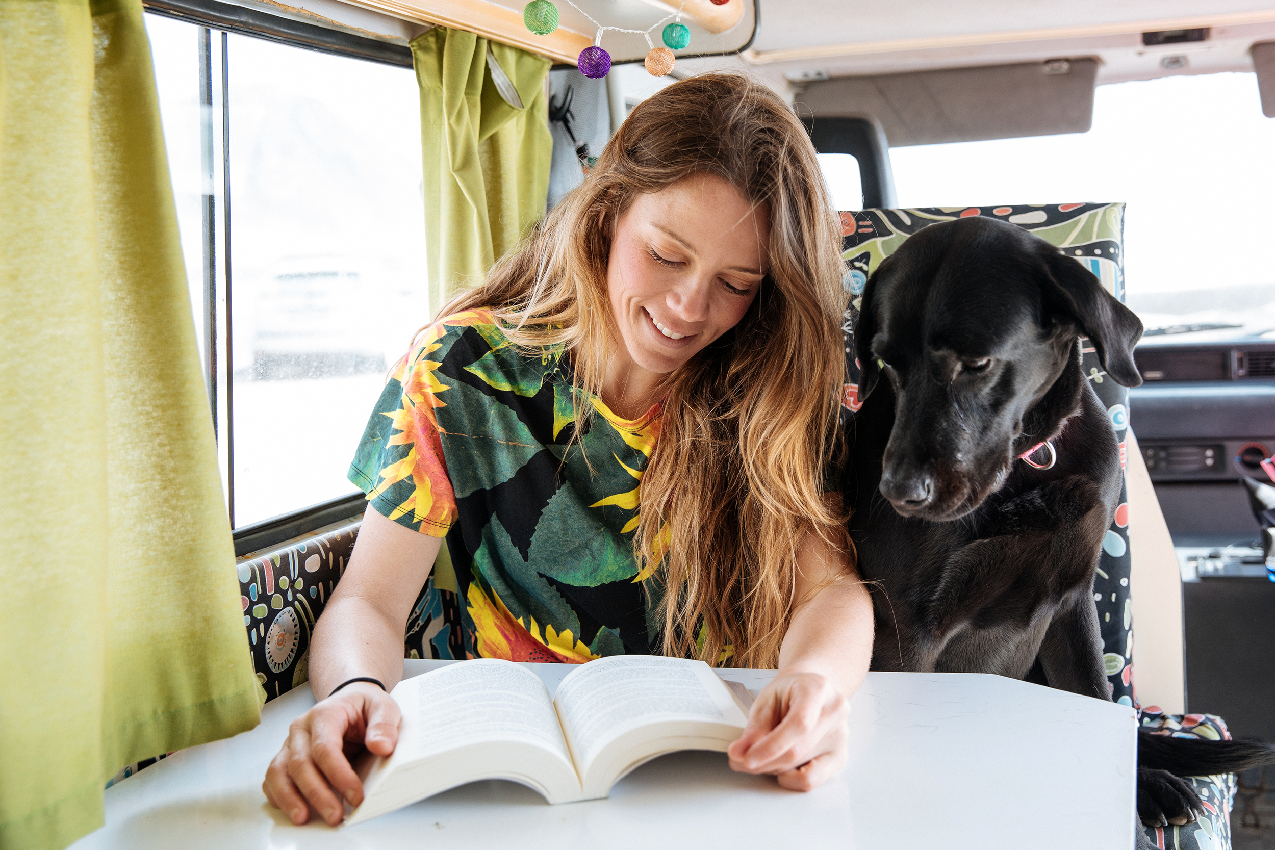 Young woman and her dog in an RV