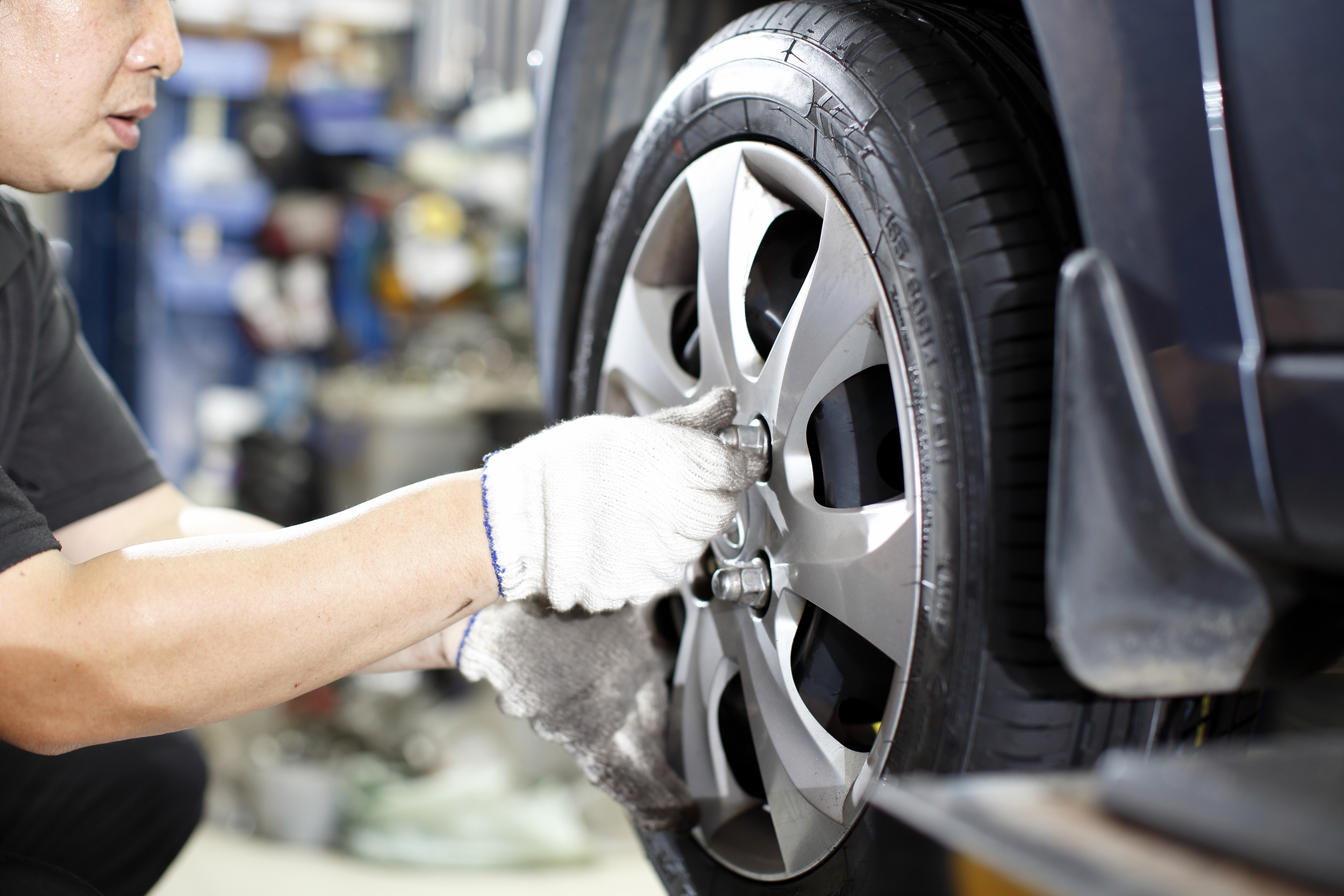 Mechanic rotating a car's tires