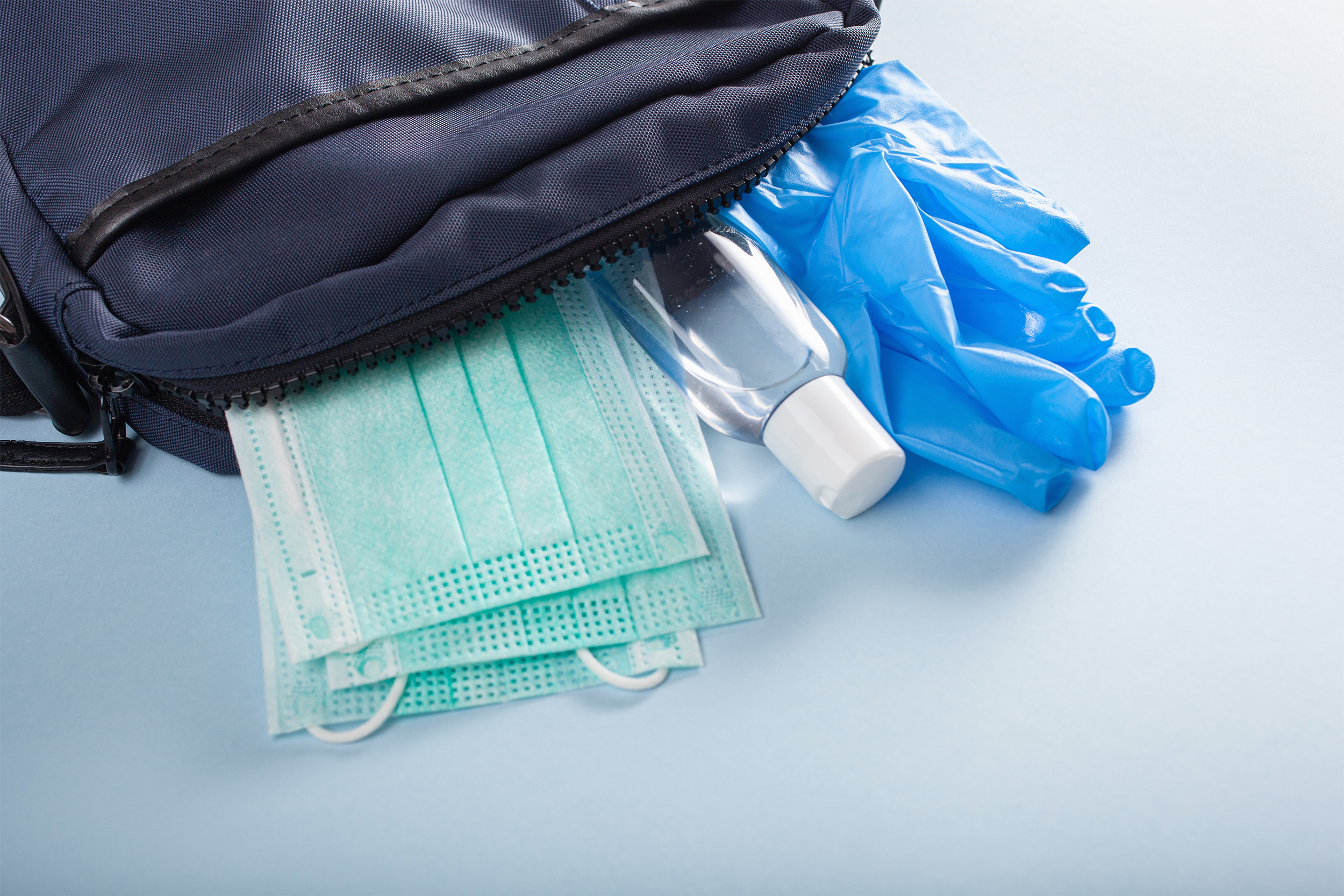 bag with gloves, masks, and hand sanitizer
