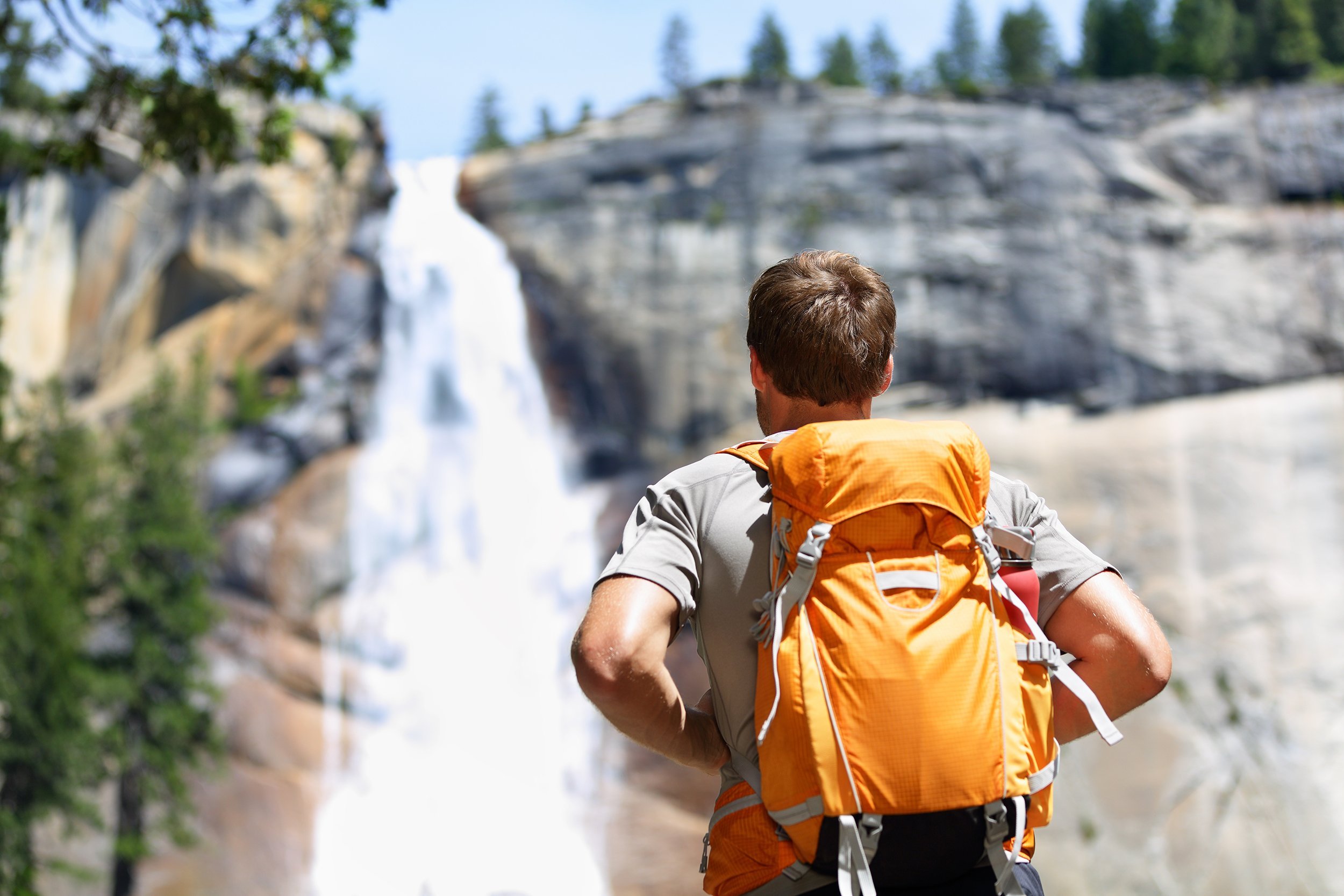 man going backpacking in a national park