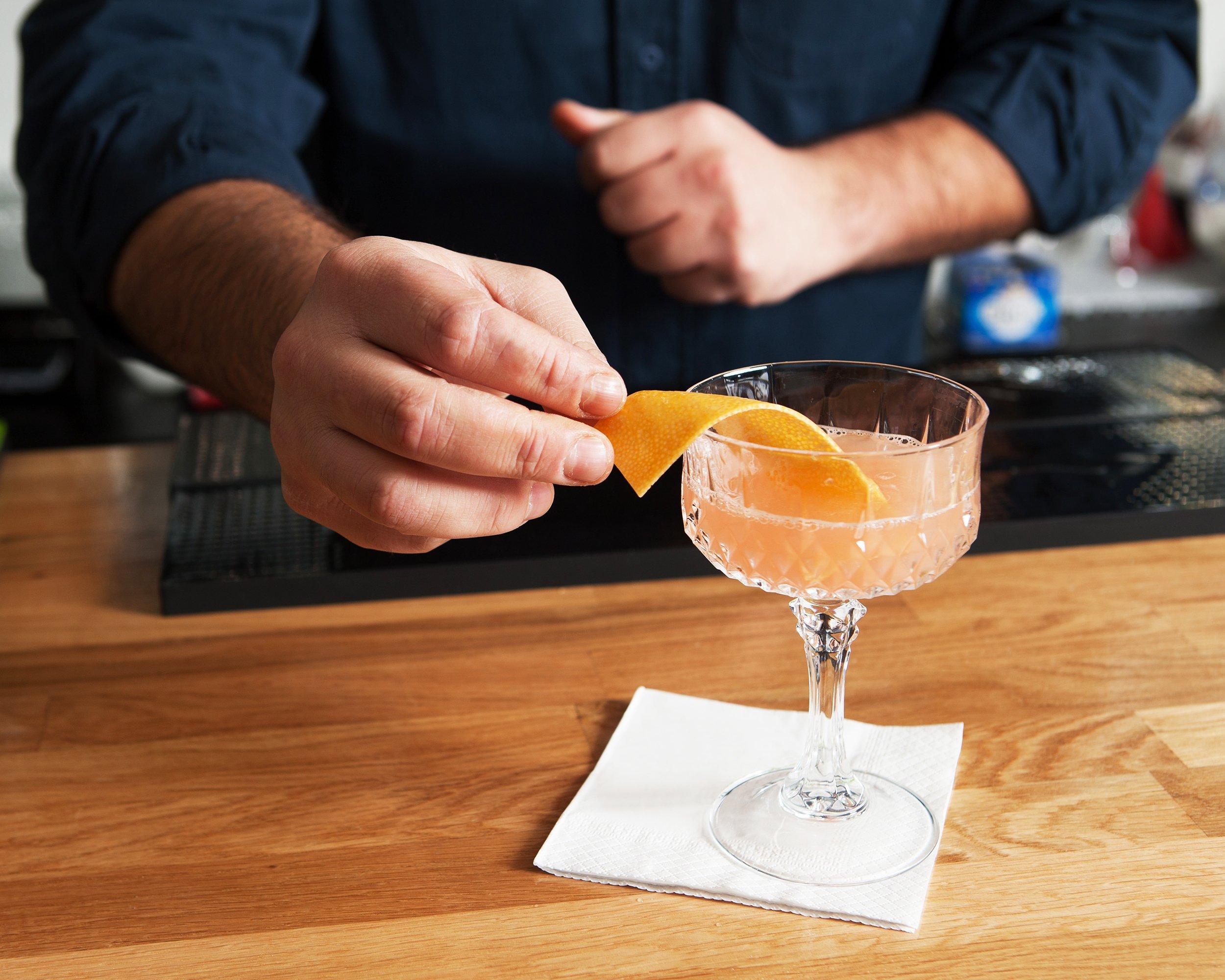 man making a cocktail