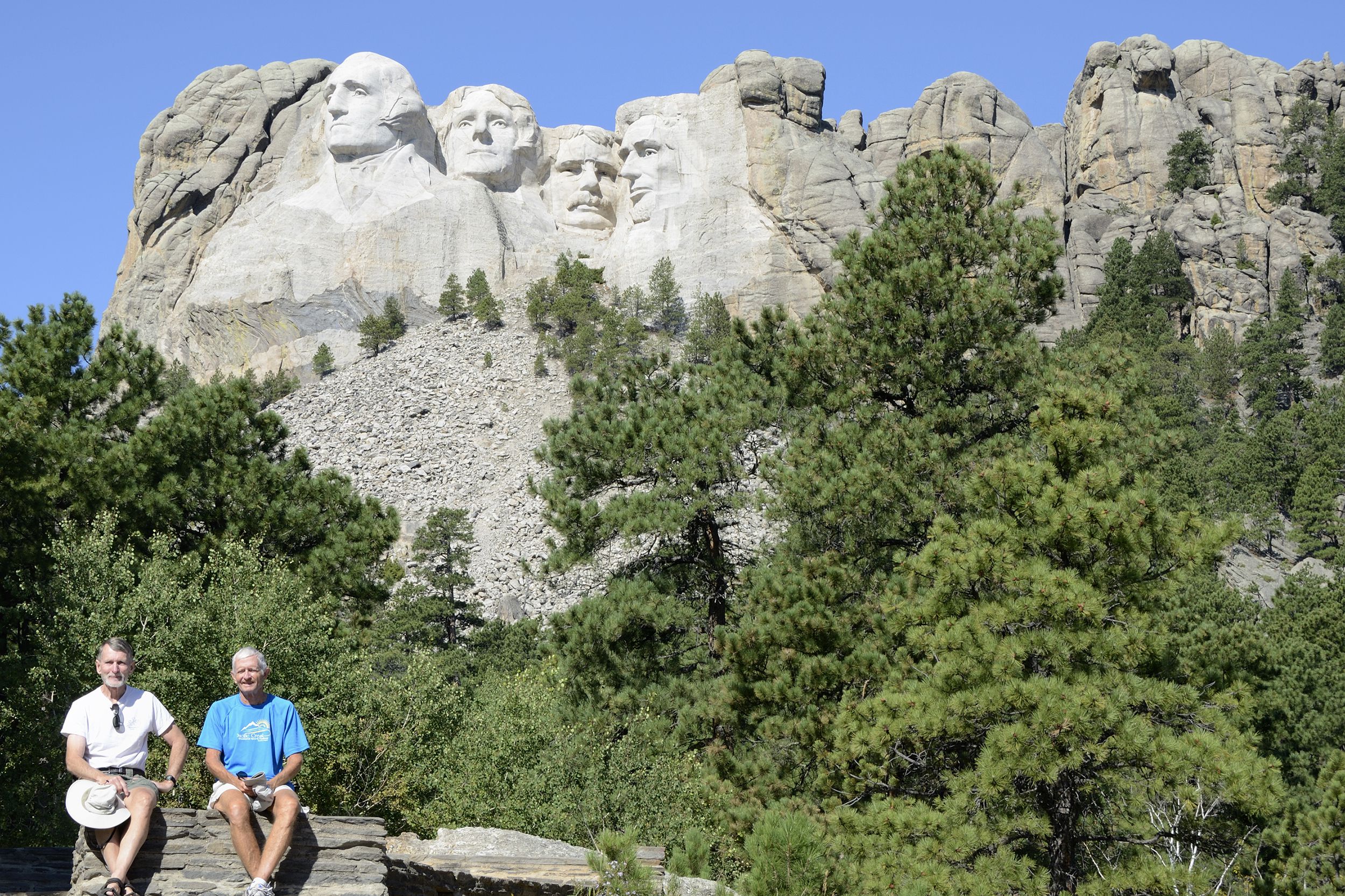 two senior men in front of Mount Rushmore National Monument, South Dakota