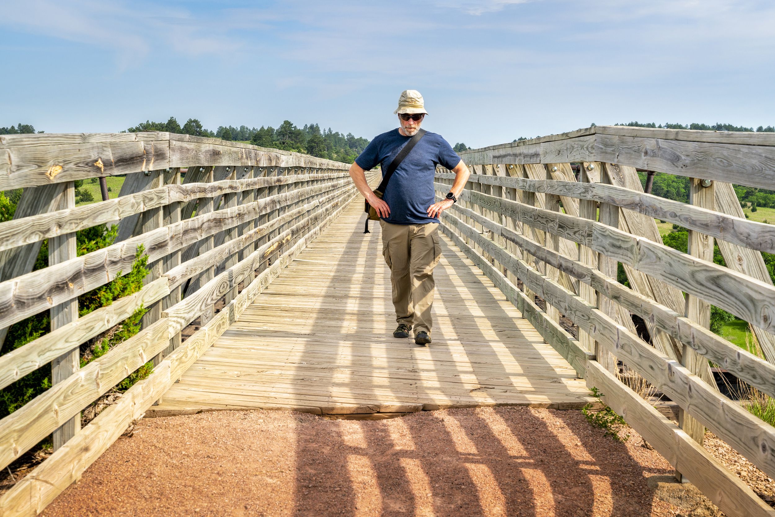senior walking on recreational Cowboy Trail in northern Nebraska
