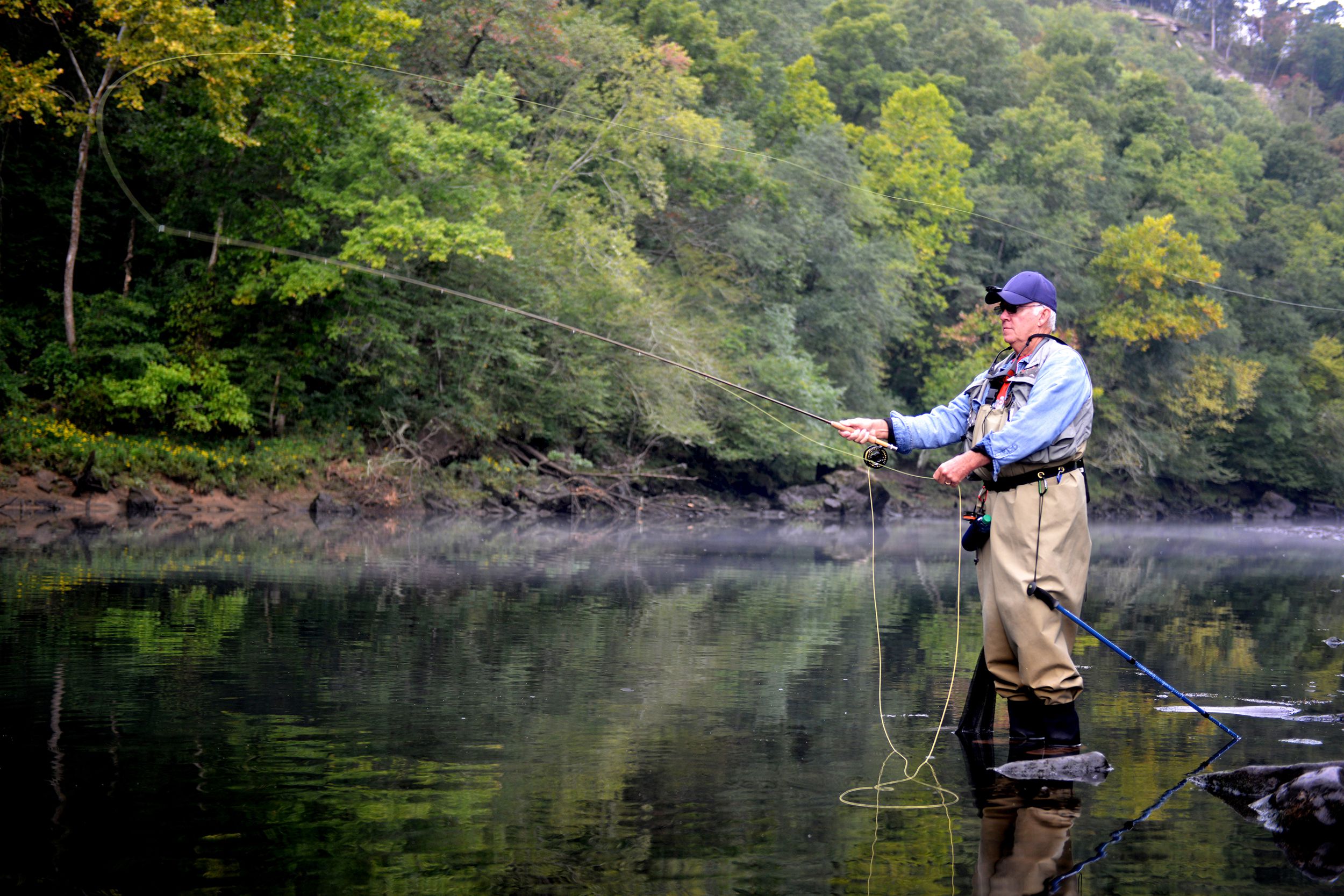 fly fisherman in the woods