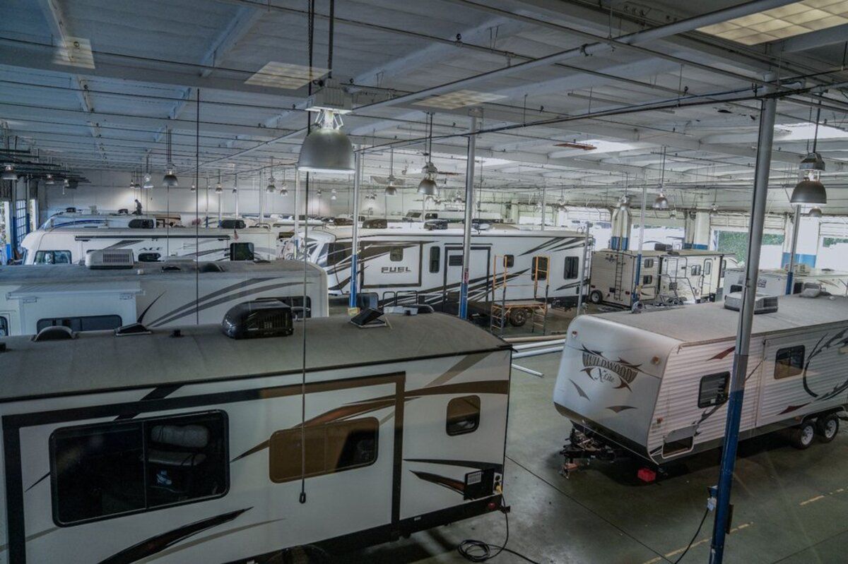 Interior of Camping World, Burlington, Washington, several RVs for sale, clean well-lit ceiling