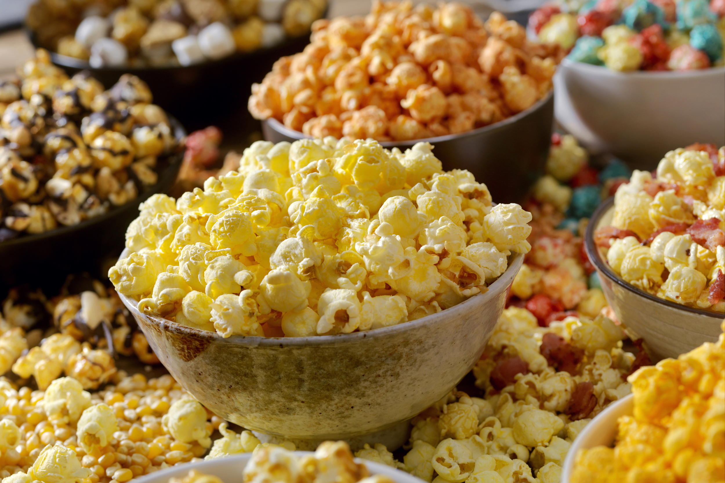 Bowls of flavored popcorn
