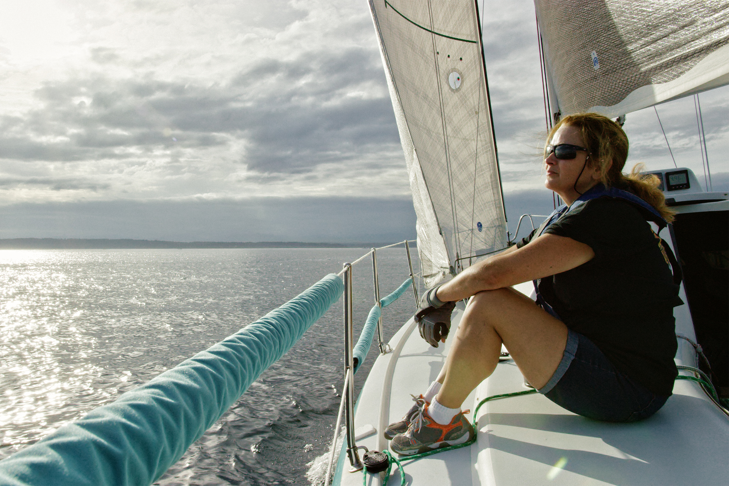 woman sitting on a boat in Puget Sound, Washington